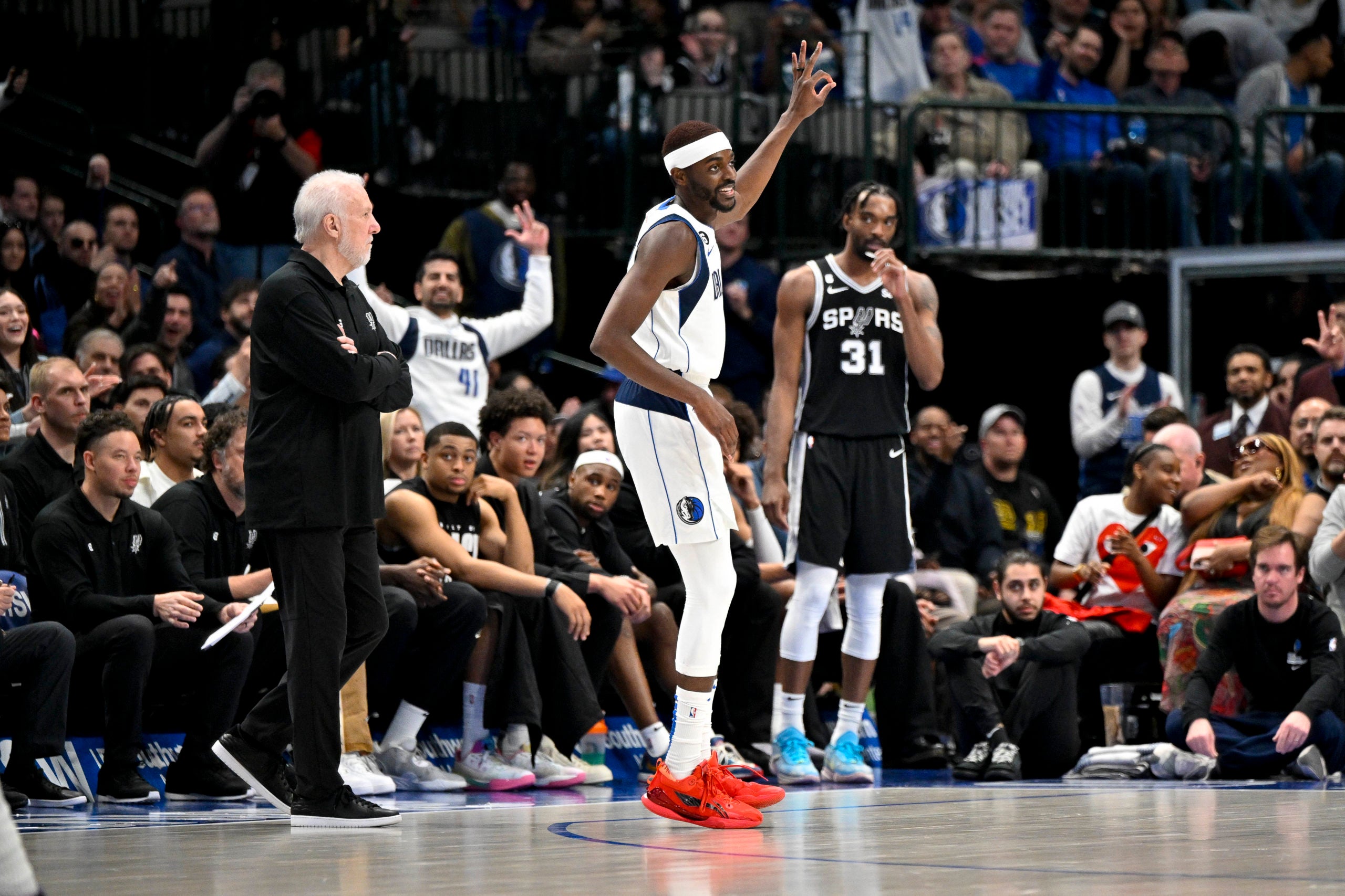 Dallas, Texas, USA; Dallas Mavericks forward Justin Holiday (0) celebrates after he makes a three point shot against the San Antonio Spurs during the second half at the American Airlines Center.