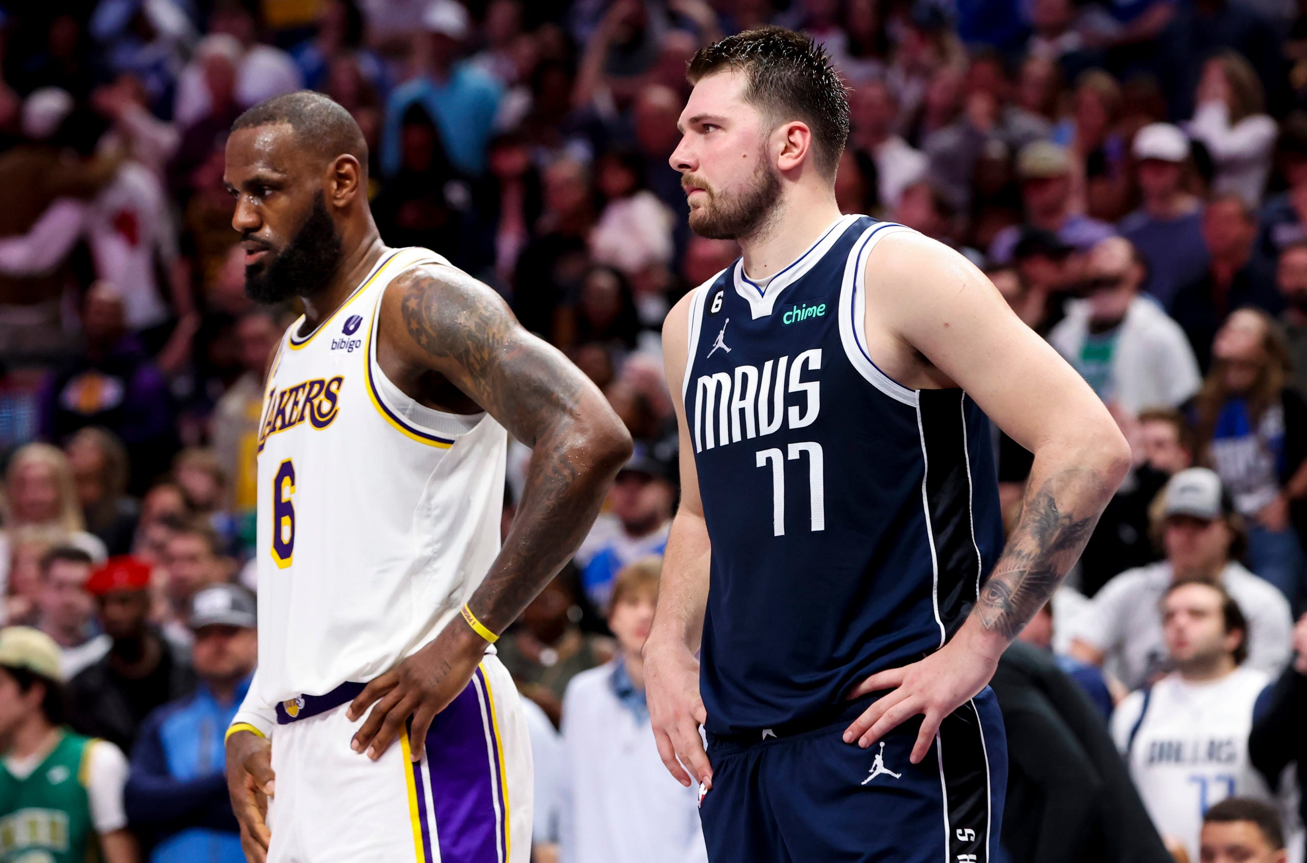 USA; Los Angeles Lakers forward LeBron James (6) and Dallas Mavericks guard Luka Doncic (77) during the fourth quarter at American Airlines Center.