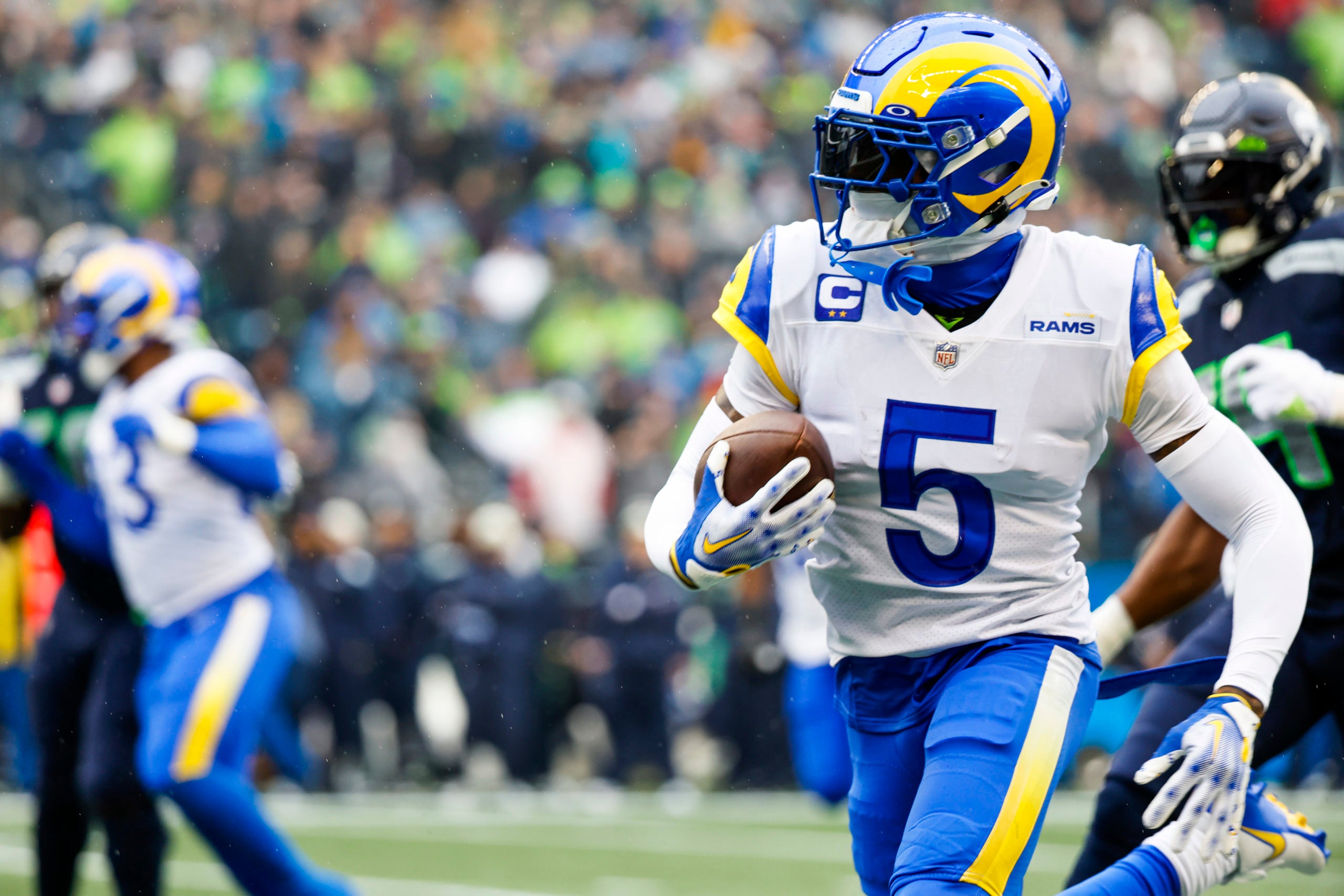 Jan 8, 2023; Seattle, Washington, USA; Los Angeles Rams cornerback Jalen Ramsey (5) returns an interception against the Seattle Seahawks during the first quarter at Lumen Field. Mandatory Credit: Joe Nicholson-USA TODAY Sports