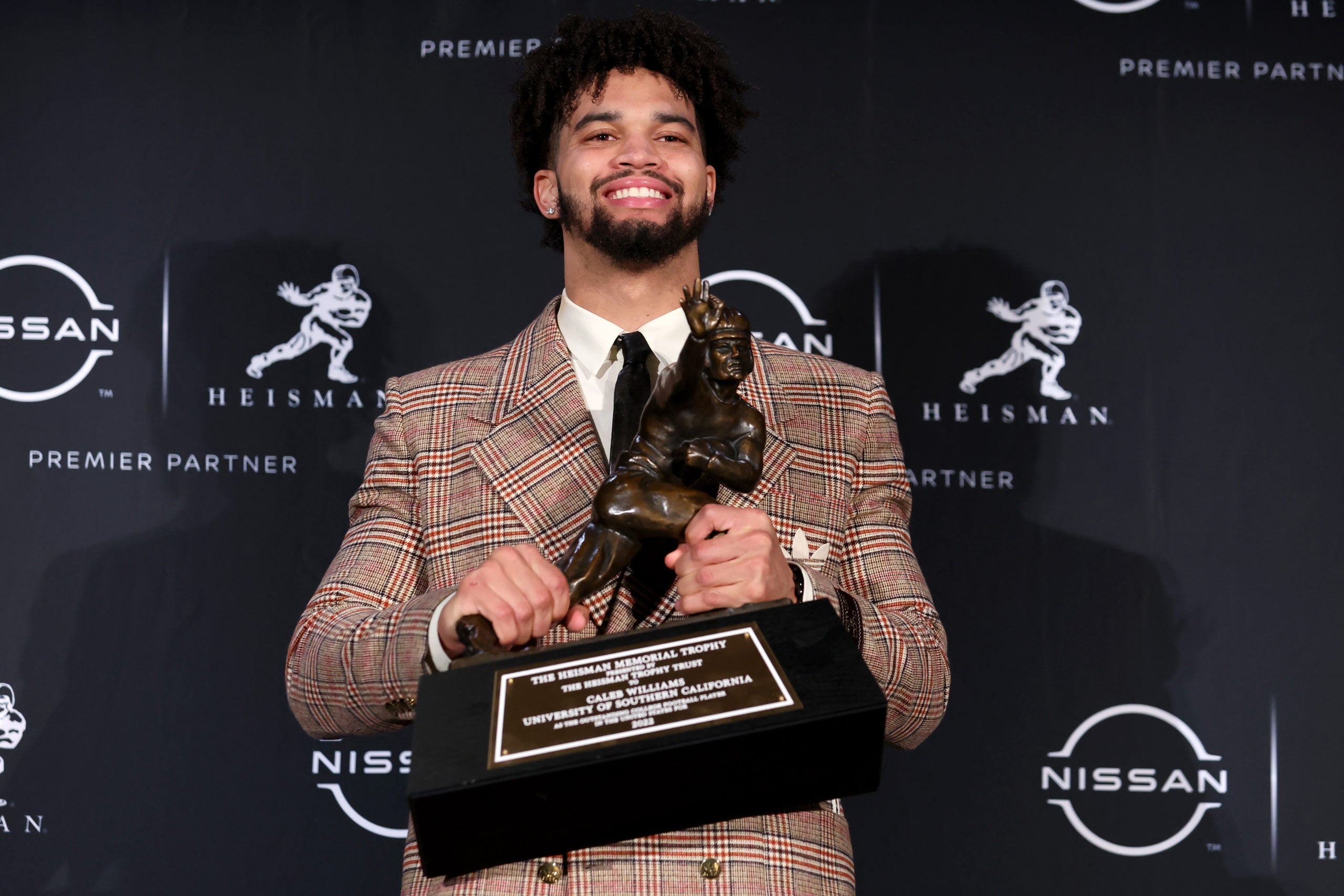 Miami Dolphins Caleb Williams USC People Magazine 2024 draft prospect QB quarterback NFL football stats news Tua Tagovailoa