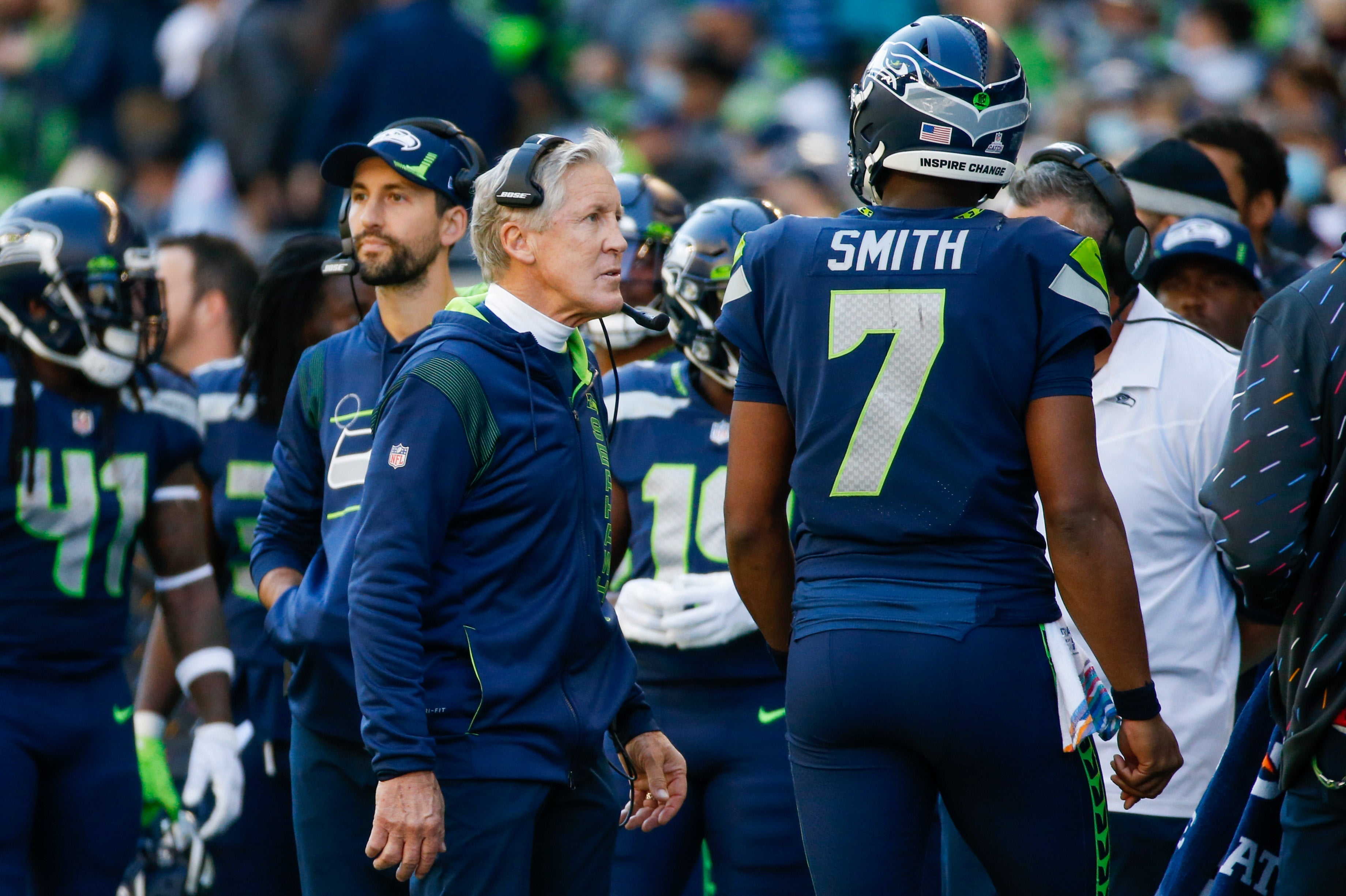 Oct 31, 2021; Seattle, Washington, USA; Seattle Seahawks head coach Pete Carroll talks with quarterback Geno Smith (7) during the second quarter against the Jacksonville Jaguars at Lumen Field.