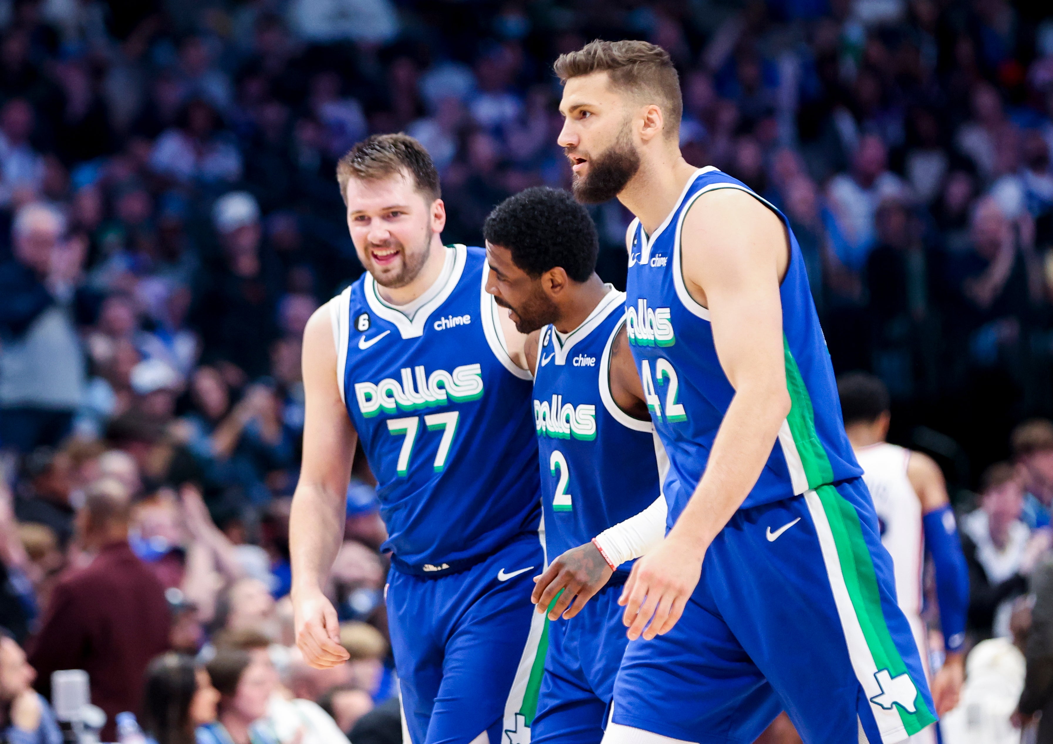 Mar 2, 2023; Dallas, Texas, USA; Dallas Mavericks guard Luka Doncic (77) and Dallas Mavericks guard Kyrie Irving (2) and Dallas Mavericks forward Maxi Kleber (42) celebrate during the second half against the Philadelphia 76ers at American Airlines Center.