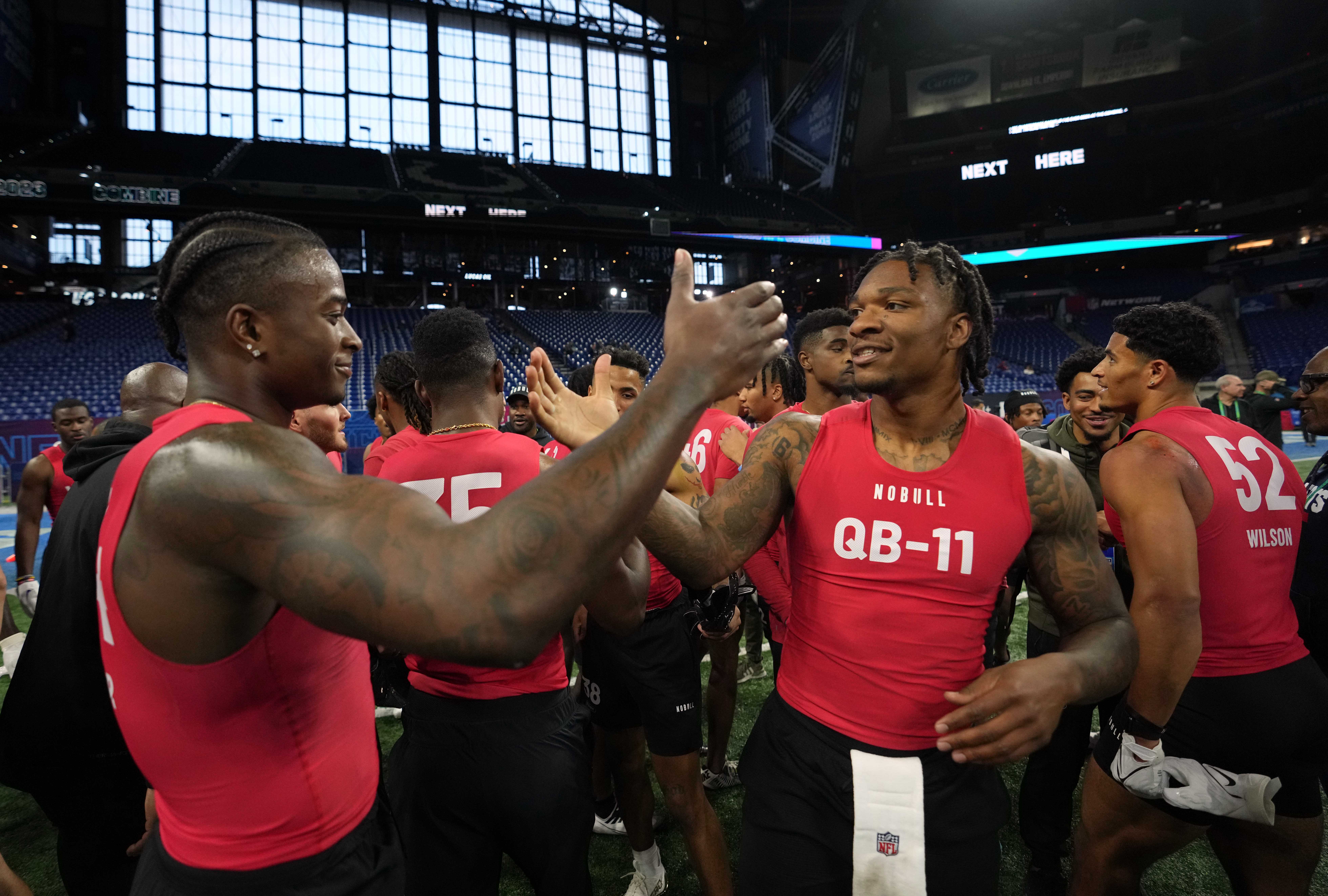 Mar 4, 2023; Indianapolis, IN, USA; Florida wide receiver Justin Shorter (WO44) greets Florida quarterback Anthony Richardson (QB11) following drills at Lucas Oil Stadium.