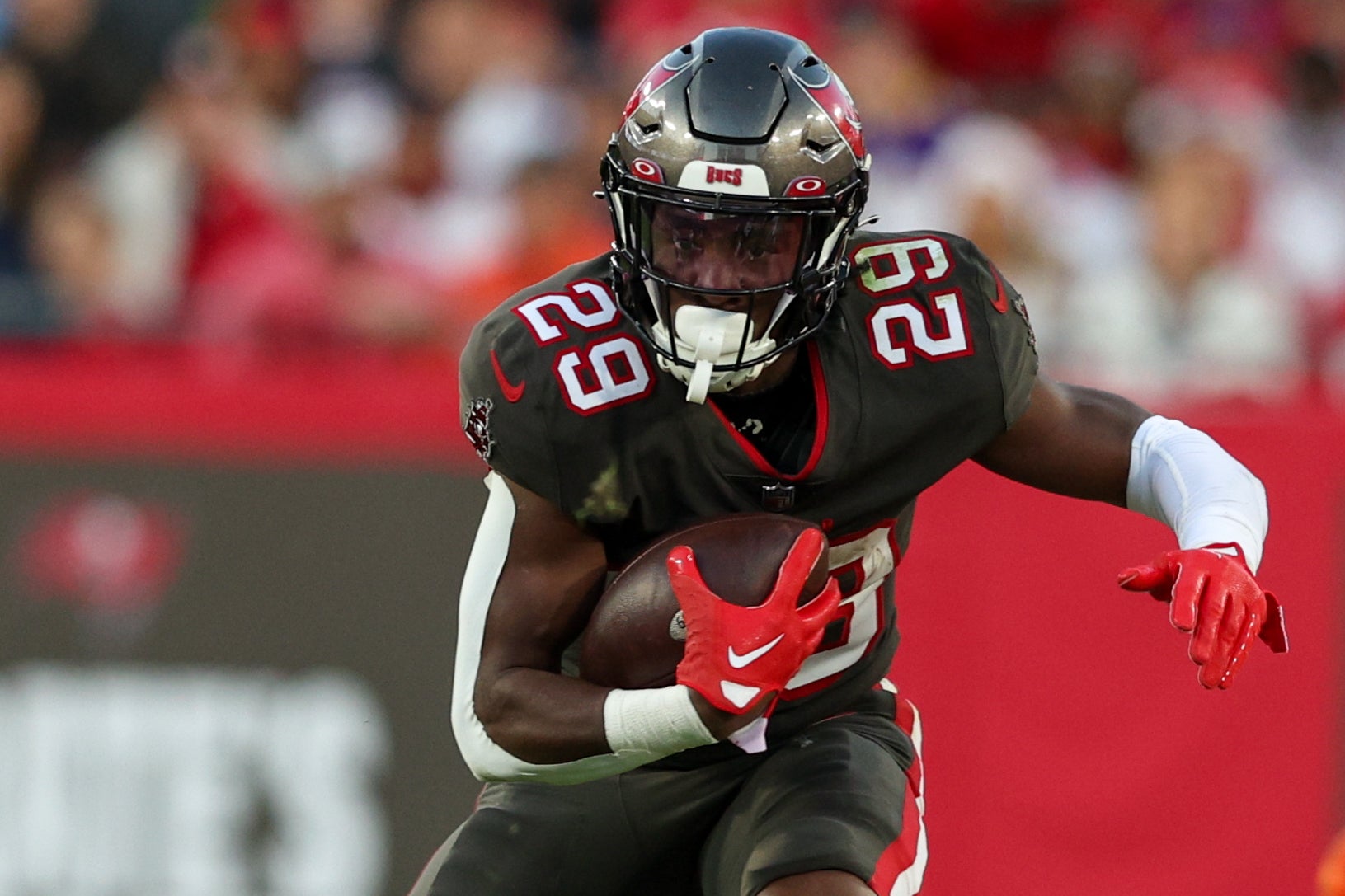 Dec 18, 2022; Tampa, Florida, USA; Tampa Bay Buccaneers running back Rachaad White (29) runs with the ball against the Cincinnati Bengals in the second quarter at Raymond James Stadium. Mandatory Credit: Nathan Ray Seebeck-USA TODAY Sports