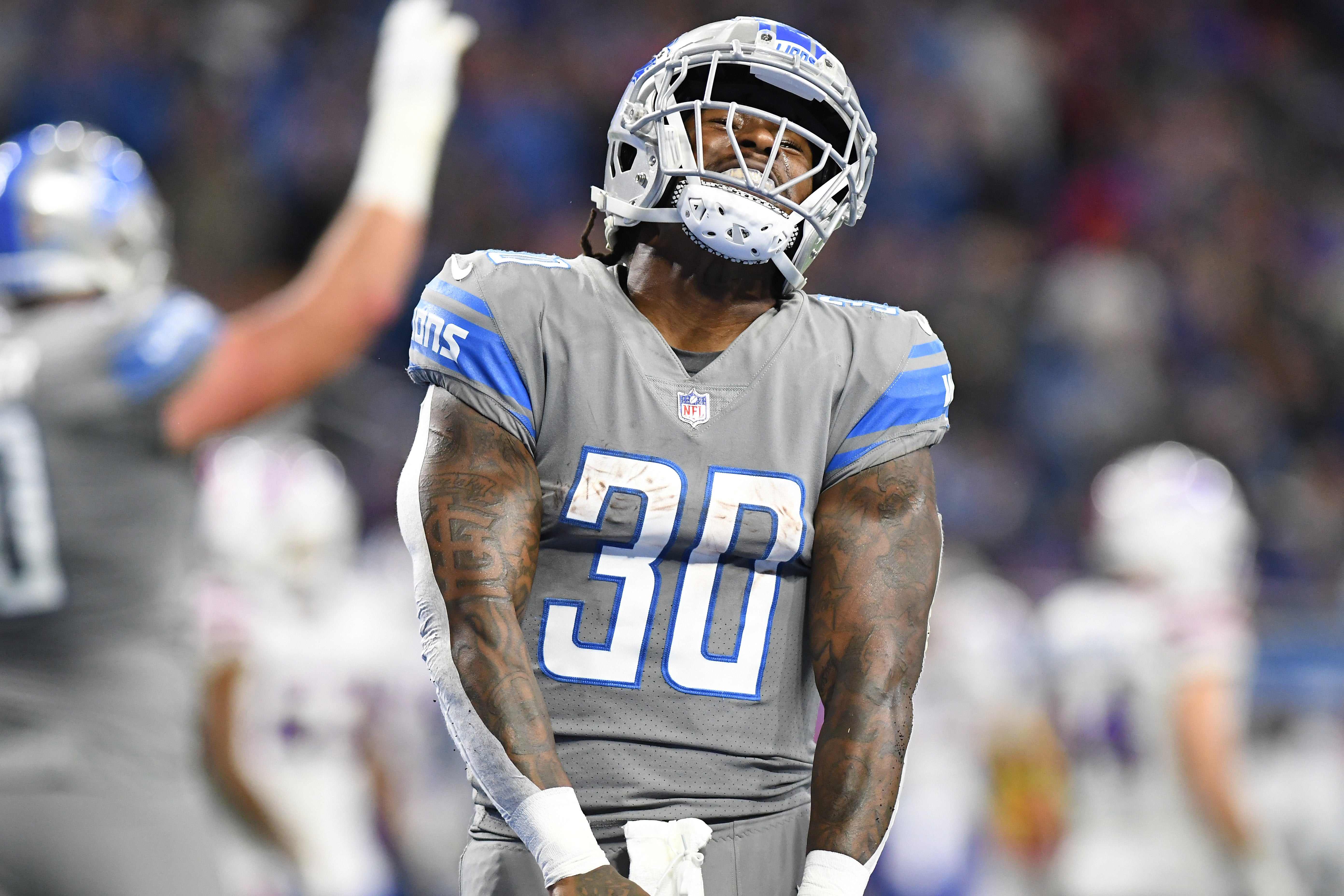 Nov 24, 2022; Detroit, Michigan, USA; Detroit Lions running back Jamaal Williams (30) celebrates after scoring a touchdown against the Buffalo Bills in the first quarter at Ford Field. Mandatory Credit: Lon Horwedel-USA TODAY Sports