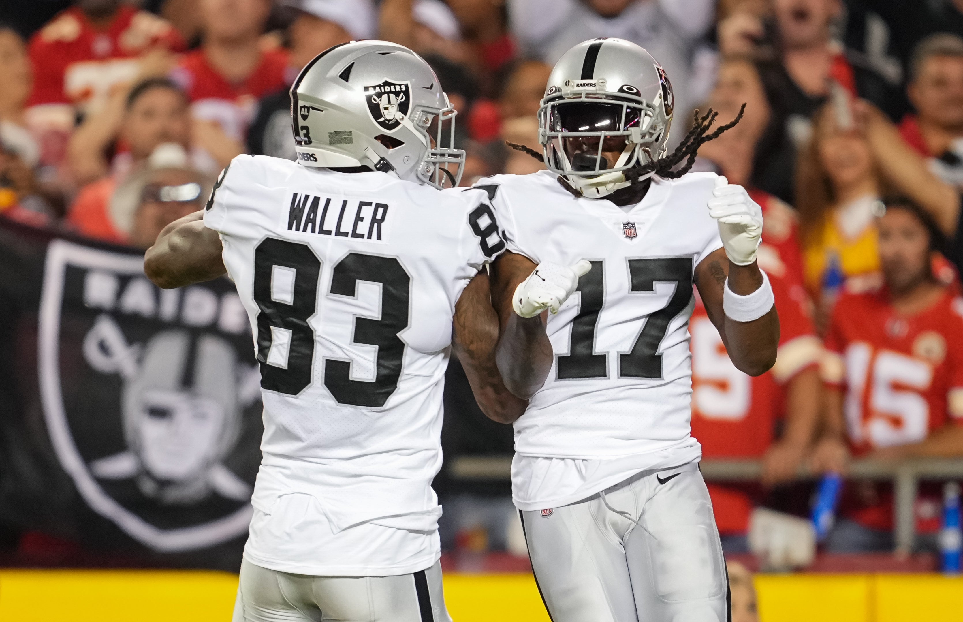 Oct 10, 2022; Kansas City, Missouri, USA; Las Vegas Raiders wide receiver Davante Adams (17) celebrates with tight end Darren Waller (83) after scoring a touchdown during the first half against the Kansas City Chiefs at GEHA Field at Arrowhead Stadium.