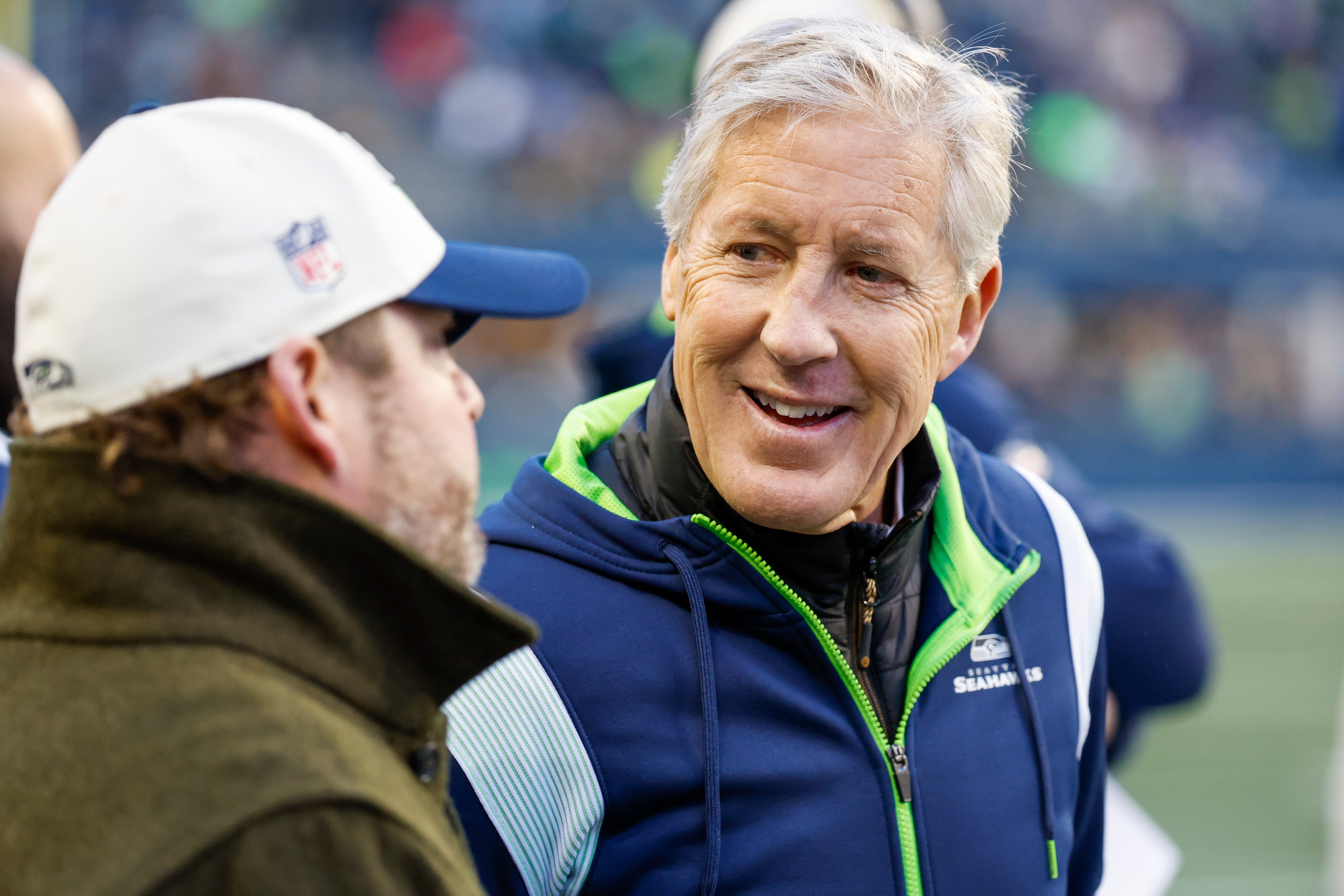 Jan 1, 2023; Seattle, Washington, USA; Seattle Seahawks head coach Pete Carroll, right, talks with general manager John Schneider during a fourth quarter timeout against the New York Jets at Lumen Field.