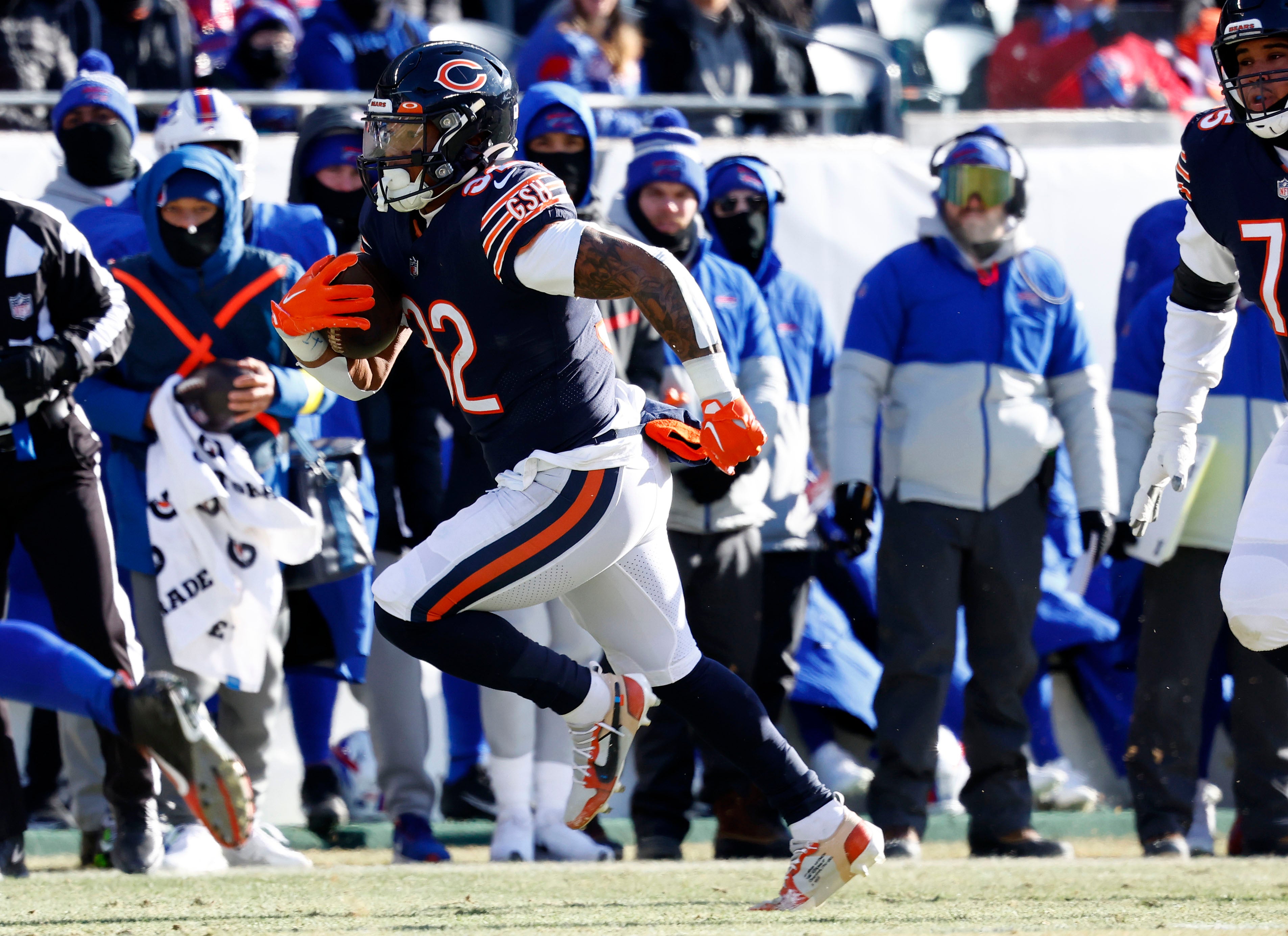 Dec 24, 2022; Chicago, Illinois, USA; Chicago Bears running back David Montgomery (32) rushes the ball against the Buffalo Bills during the first quarter at Soldier Field. Mandatory Credit: Mike Dinovo-USA TODAY Sports