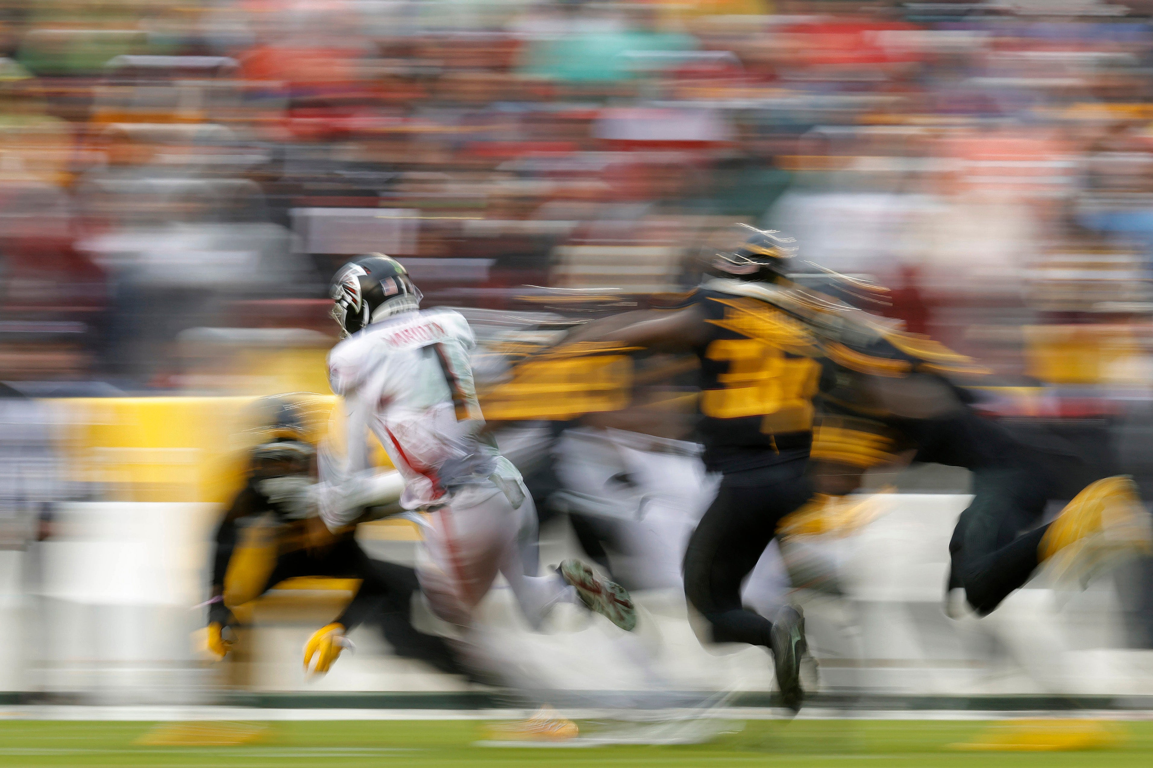 Nov 27, 2022; Landover, Maryland, USA; Atlanta Falcons quarterback Marcus Mariota (1) runs with the ball against the Washington Commanders at FedExField
