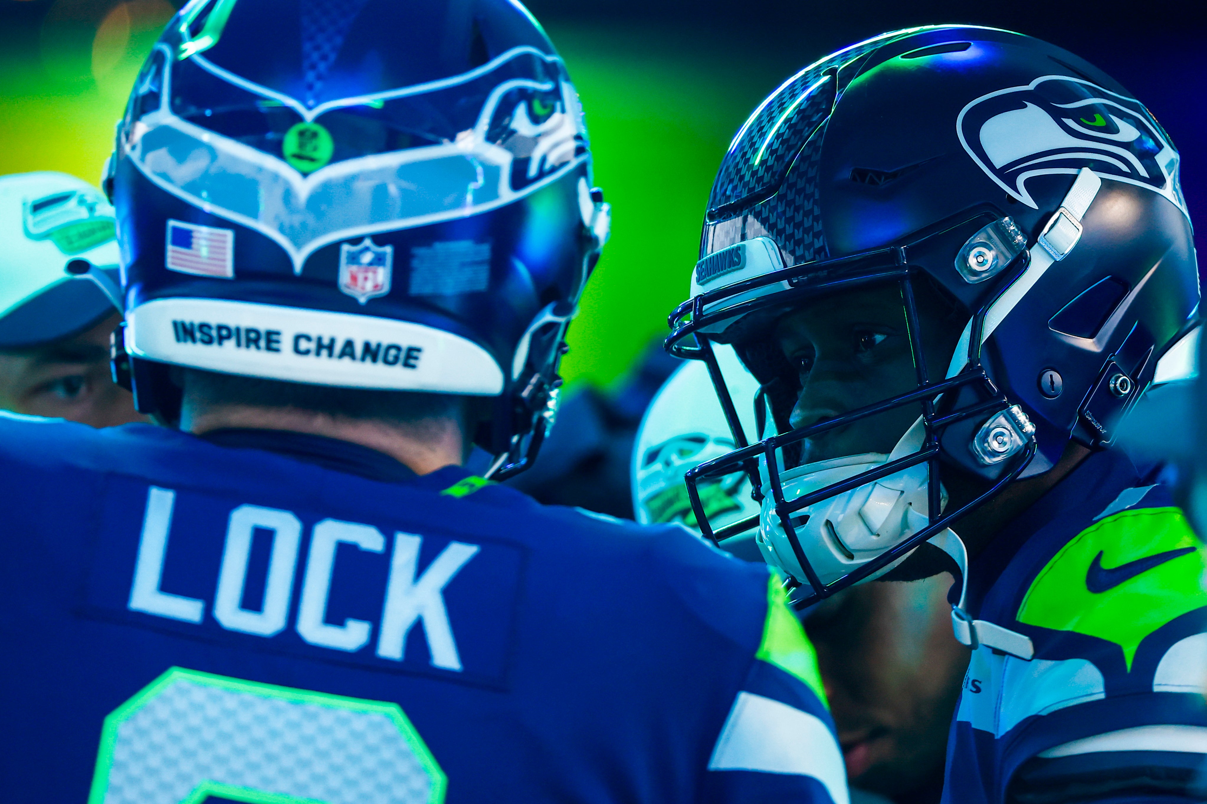 Dec 11, 2022; Seattle, Washington, USA; Seattle Seahawks quarterback Geno Smith (7) talks with quarterback Drew Lock (2) outside the locker room before pregame warmups against the Carolina Panthers at Lumen Field.