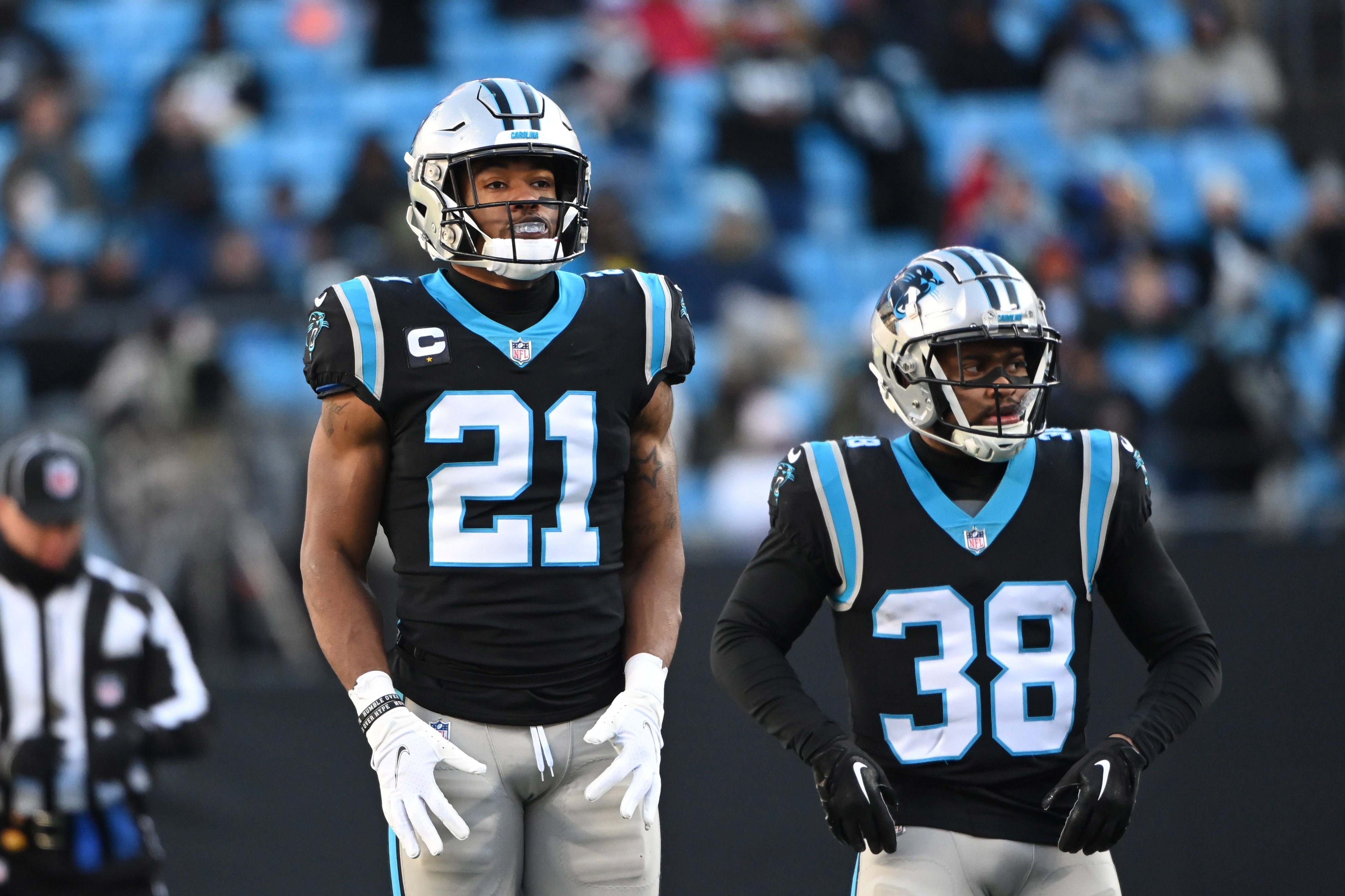 Dec 24, 2022; Charlotte, North Carolina, USA; Carolina Panthers safety Jeremy Chinn (21) and cornerback Myles Hartsfield (38) on the field in the third quarter at Bank of America Stadium.