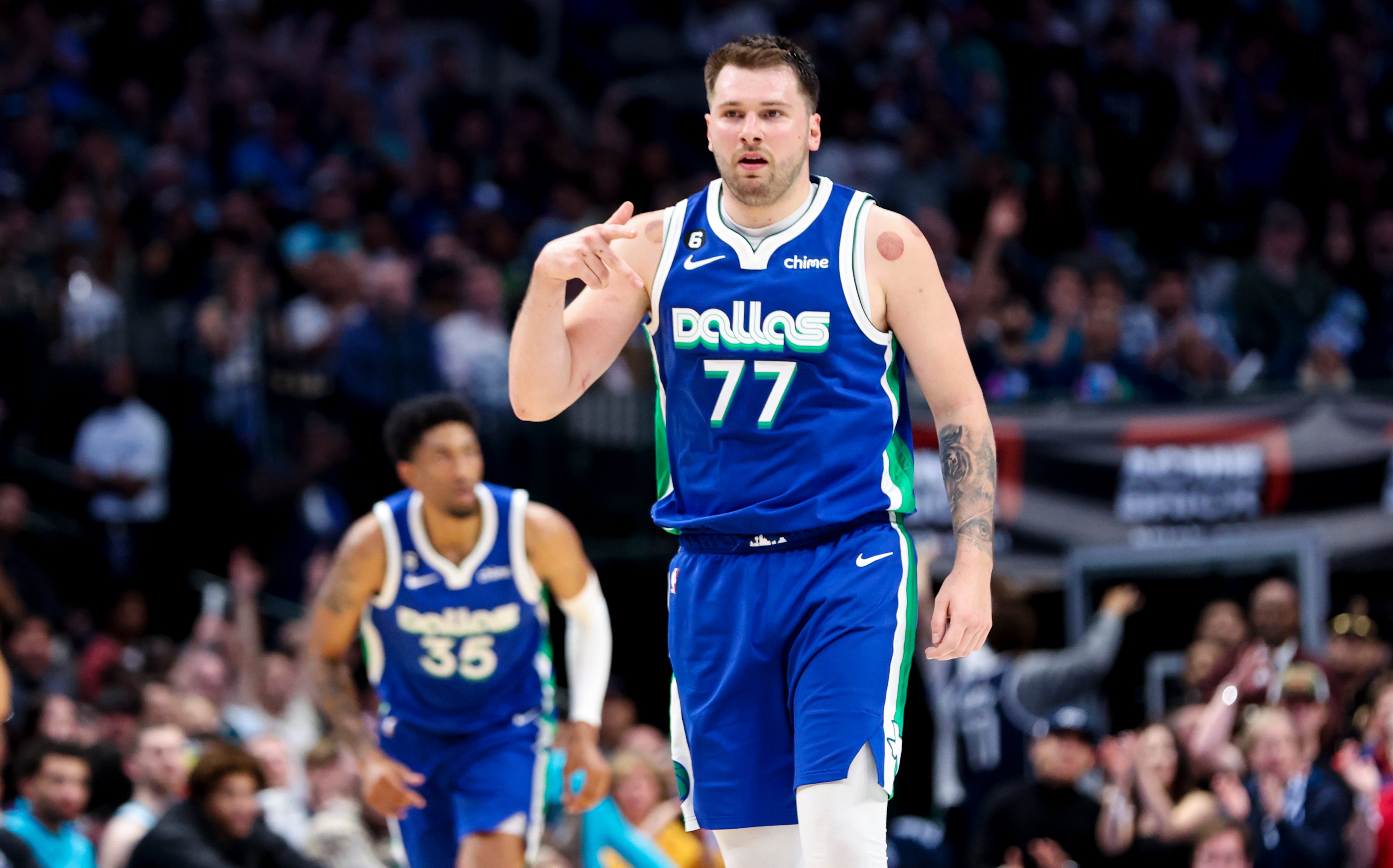Mar 24, 2023; Dallas, Texas, USA; Dallas Mavericks guard Luka Doncic (77) reacts after scoring during the third quarter against the Charlotte Hornets at American Airlines Center.