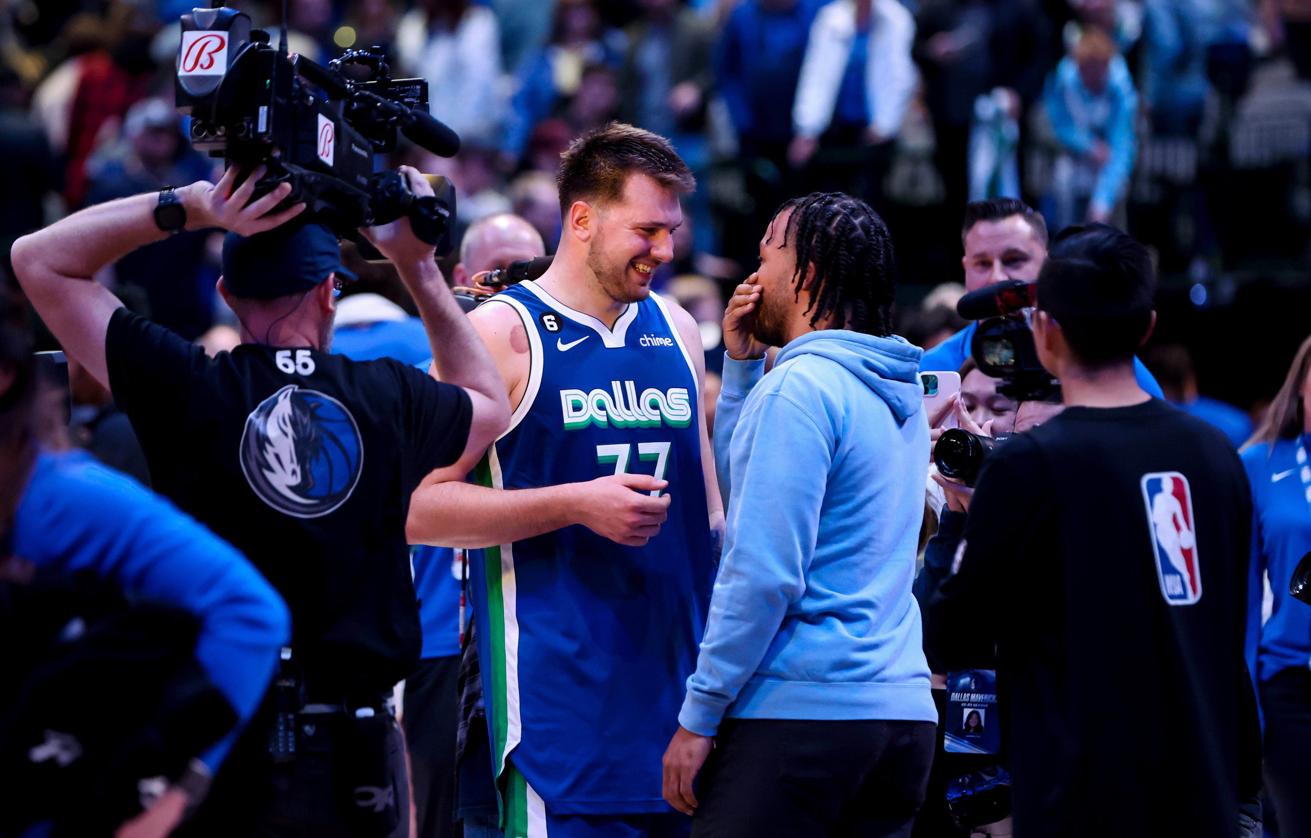 Dec 27, 2022; Dallas, Texas, USA; Dallas Mavericks guard Luka Doncic (77) speaks with New York Knicks guard Jalen Brunson (11) after the game at American Airlines Center.