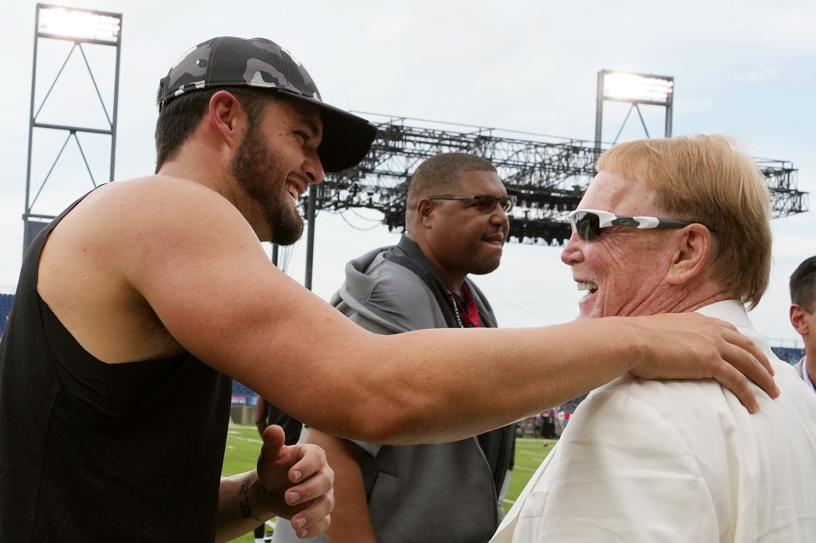 Aug 4, 2022; Canton, Ohio, USA; Las Vegas Raiders quarterback Derek Carr (4) talks with owner Mark Davis on the field before the NFL Hall of Fame game at Tom Benson Hall of Fame Stadium.