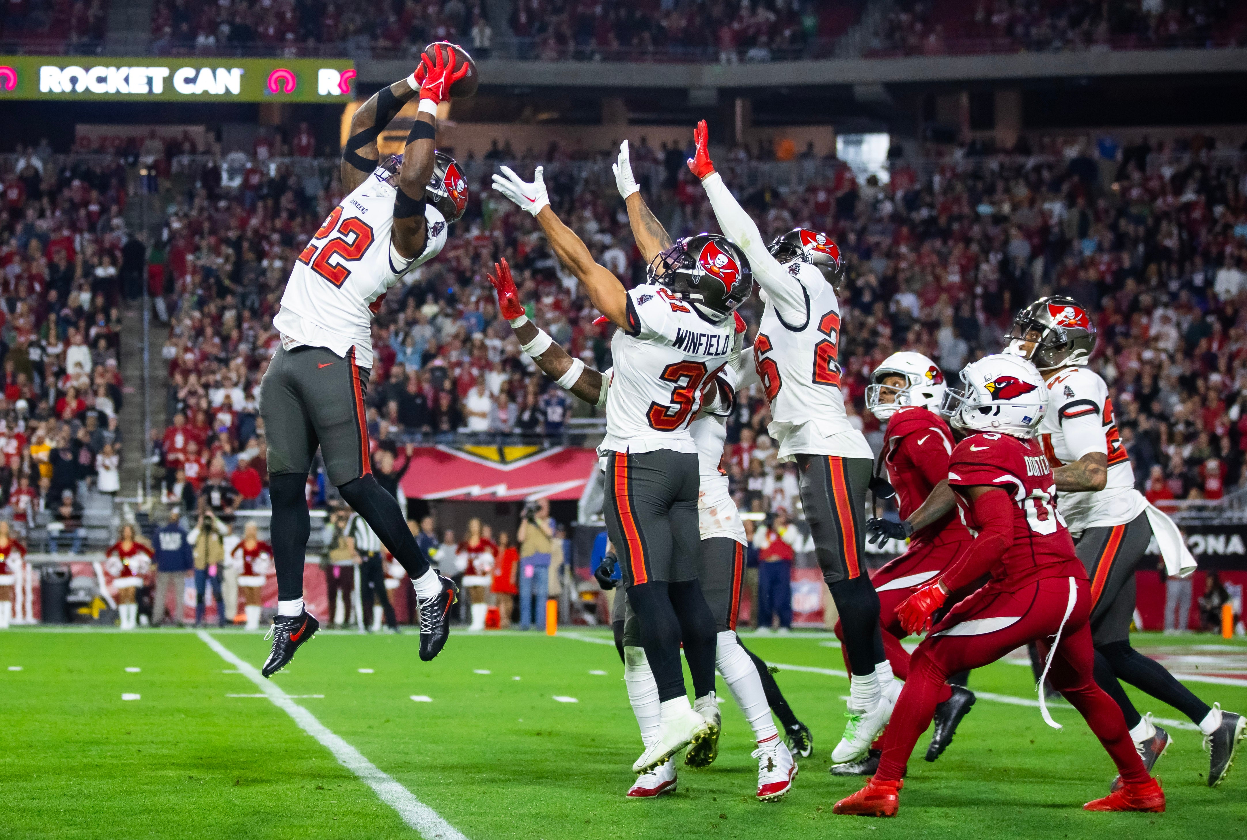 Dec 25, 2022; Glendale, Arizona, USA; Tampa Bay Buccaneers safety Keanu Neal (22) intercepts the ball against the Arizona Cardinals at State Farm Stadium. Mandatory Credit: Mark J. Rebilas-USA TODAY Sports