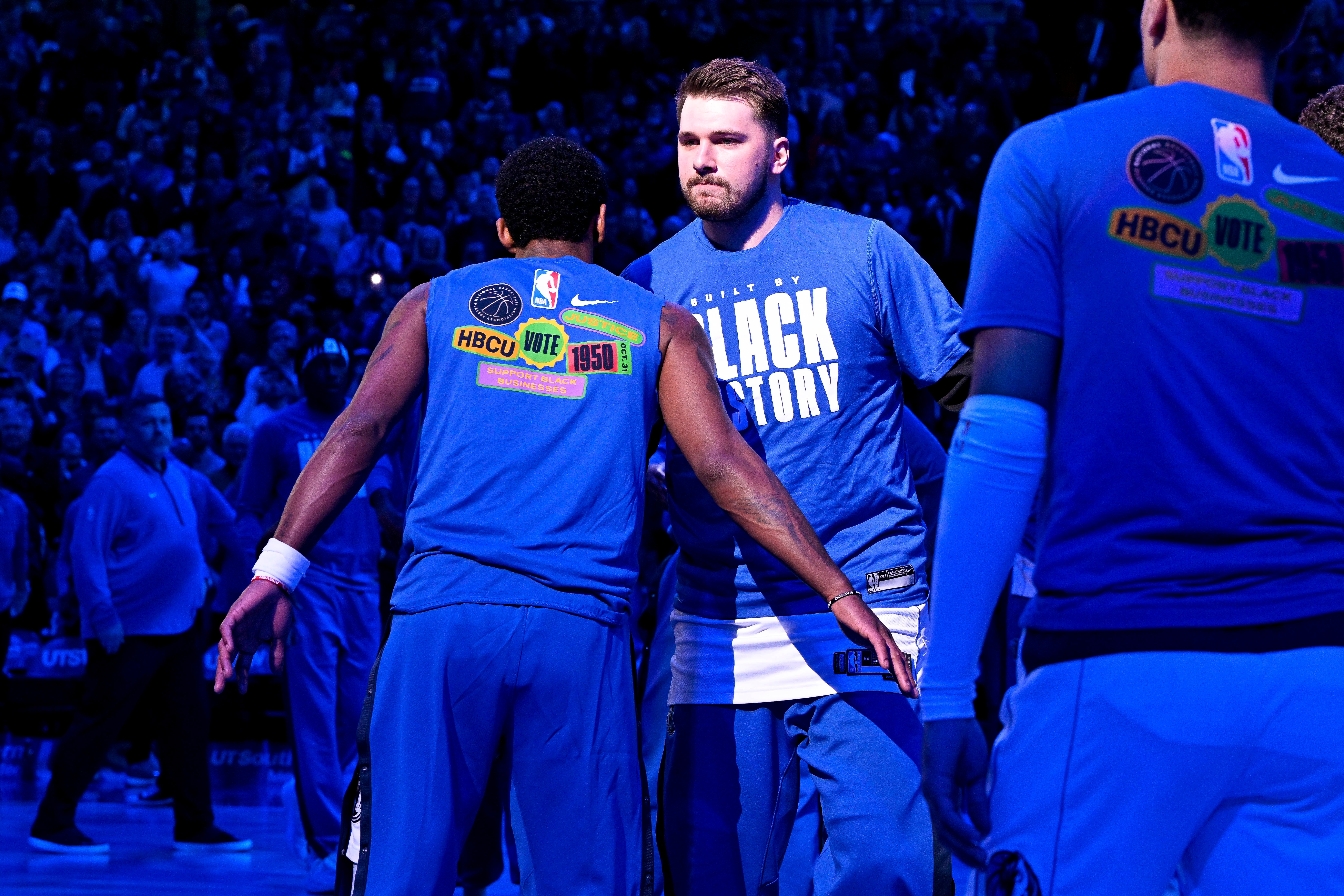 Feb 23, 2023; Dallas, Texas, USA; Dallas Mavericks guard Kyrie Irving (left) and guard Luka Doncic (right) take the court to face the San Antonio Spurs at the American Airlines Center.