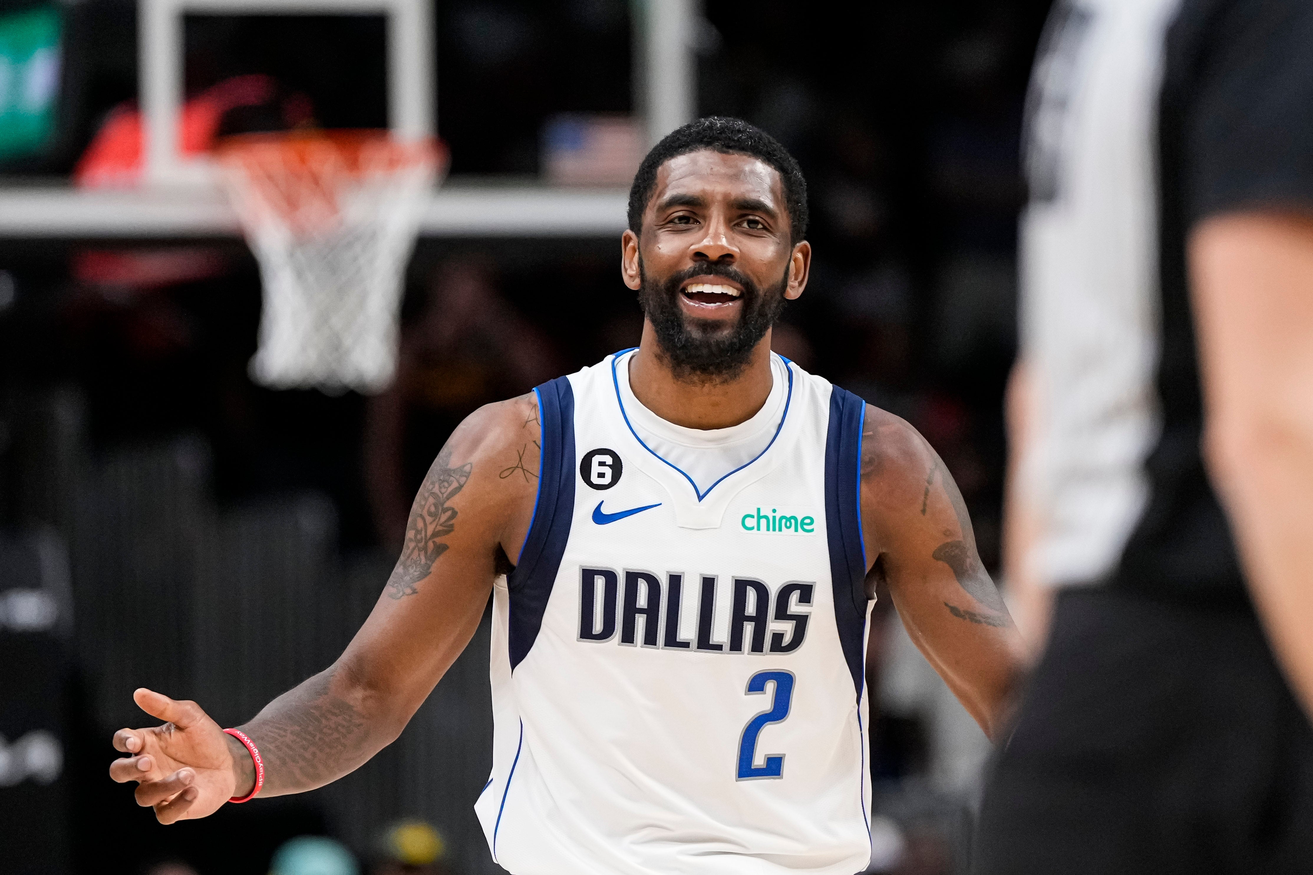 Apr 2, 2023; Atlanta, Georgia, USA; Dallas Mavericks guard Kyrie Irving (2) reacts to being called for a foul on Atlanta Hawks guard Trae Young (11) (not shown) leading to the deciding points during overtime at State Farm Arena.