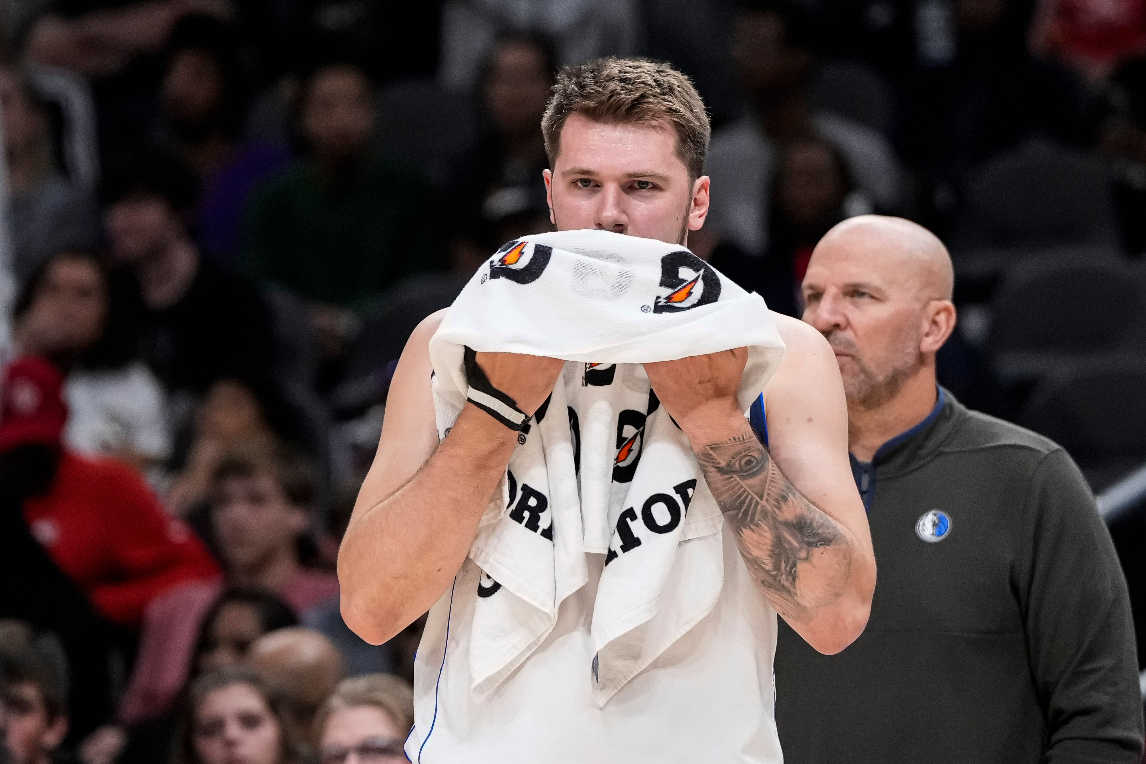 Apr 2, 2023; Atlanta, Georgia, USA; Dallas Mavericks guard Luka Doncic (77) towels off during a stoppage against the Atlanta Hawks during the first half at State Farm Arena.