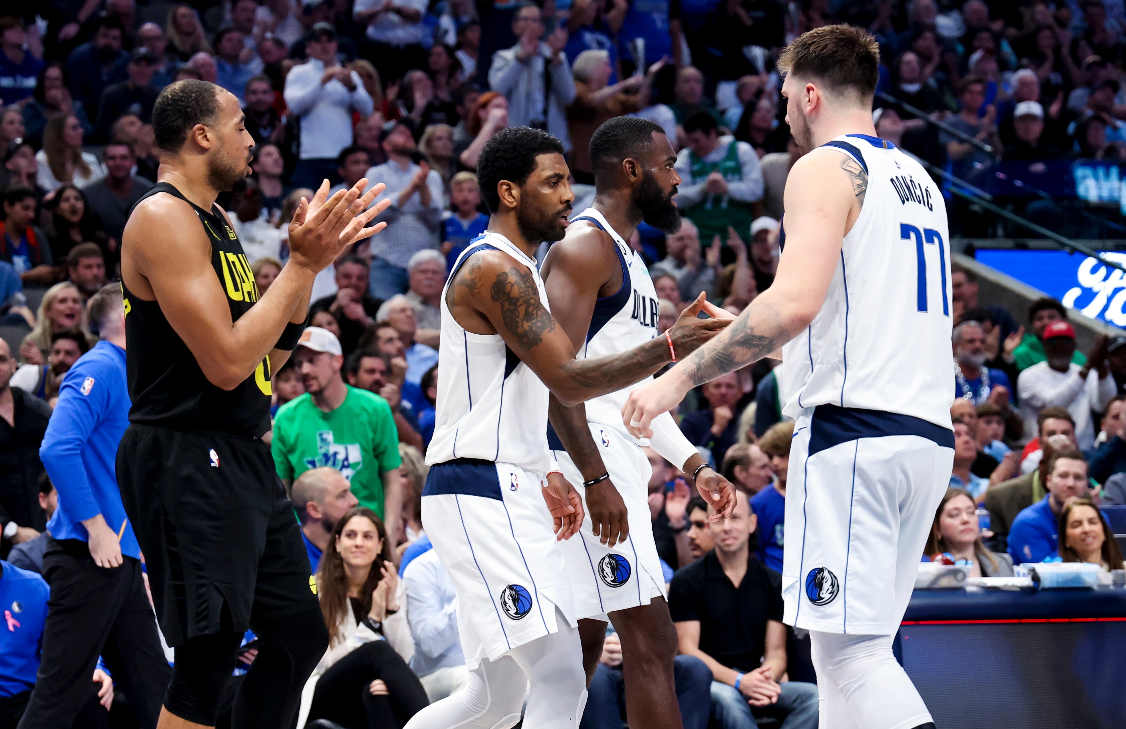 Mar 7, 2023; Dallas, Texas, USA; Dallas Mavericks guard Kyrie Irving (2) and Dallas Mavericks forward Tim Hardaway Jr. (11) and Dallas Mavericks guard Luka Doncic (77) react during the fourth quarter against the Utah Jazz at American Airlines Center.