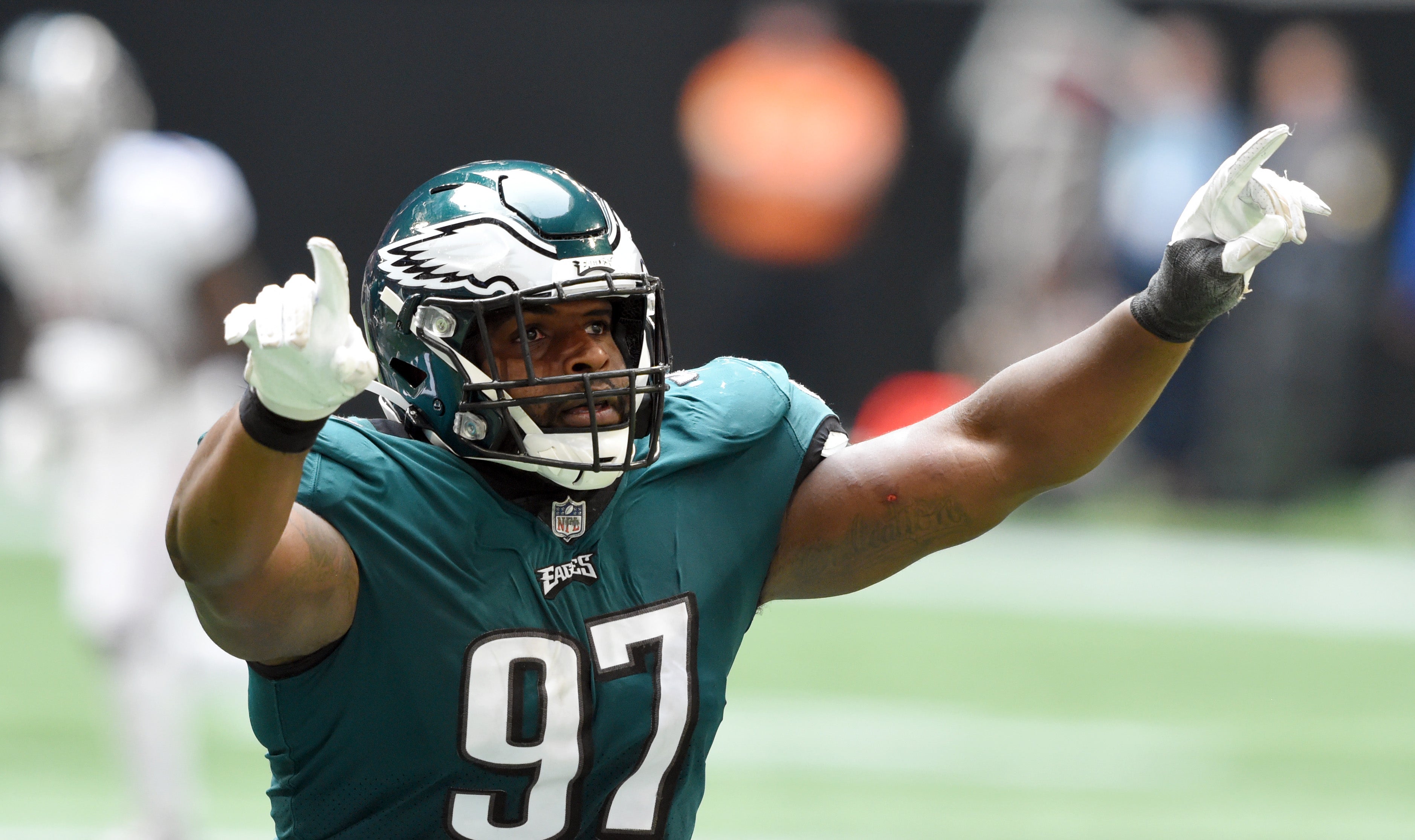 Sep 12, 2021; Atlanta, Georgia, USA; Philadelphia Eagles defensive tackle Javon Hargrave (97) celebrates his sack of Atlanta Falcons quarterback Matt Ryan (2) during the fourth quarter at Mercedes-Benz Stadium.
