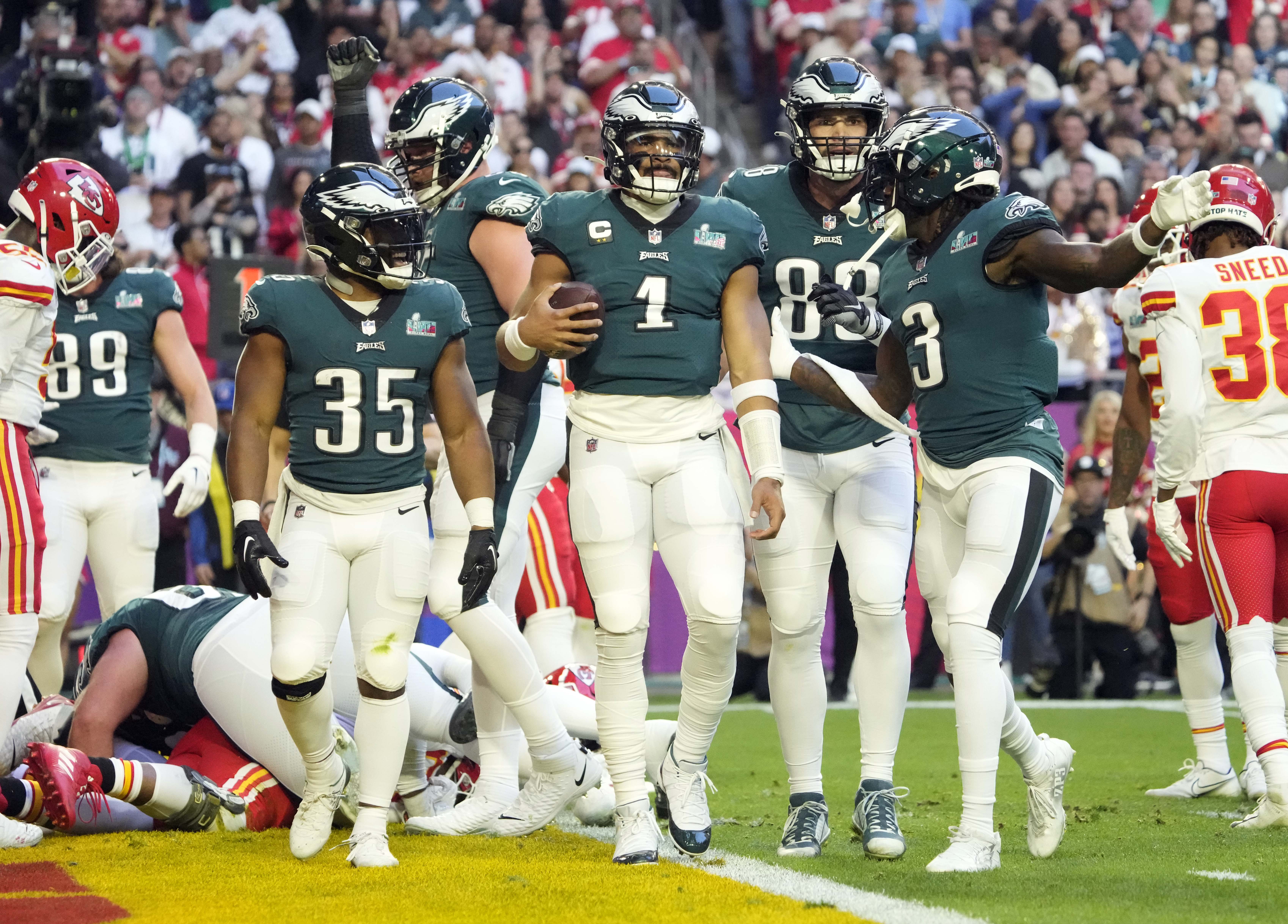 Philadelphia Eagles quarterback Jalen Hurts (1) celebrates with teammates after scoring a rushing touchdown against the Kansas City Chiefs during the first quarter in Super Bowl LVII at State Farm Stadium in Glendale on Feb. 12, 2023. Nfl Super Bowl Lvii Kansas City Chiefs Vs Philadelphia Eagles