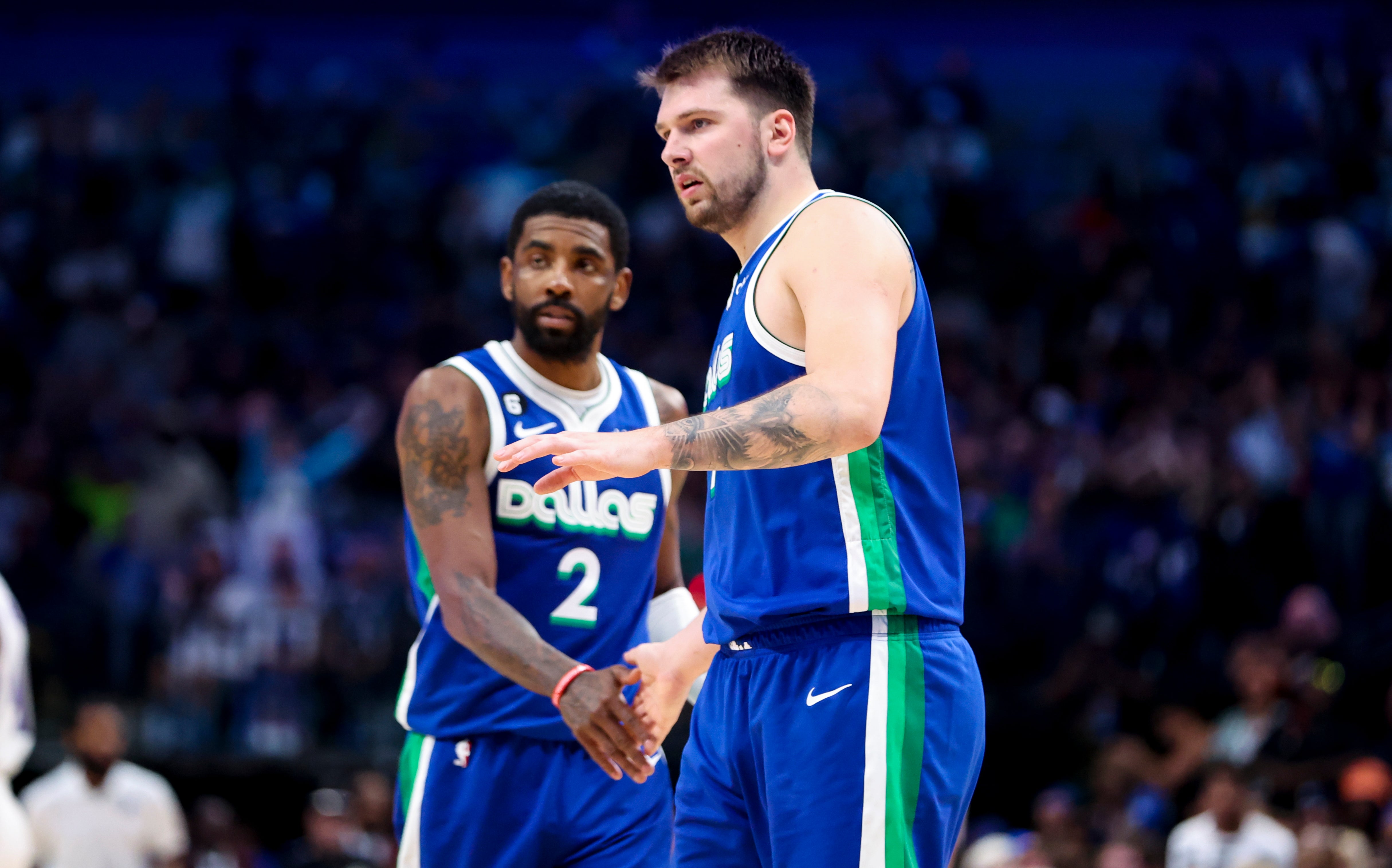 Apr 5, 2023; Dallas, Texas, USA; Dallas Mavericks guard Luka Doncic (77) and Dallas Mavericks guard Kyrie Irving (2) react during the fourth quarter against the Sacramento Kings at American Airlines Center.