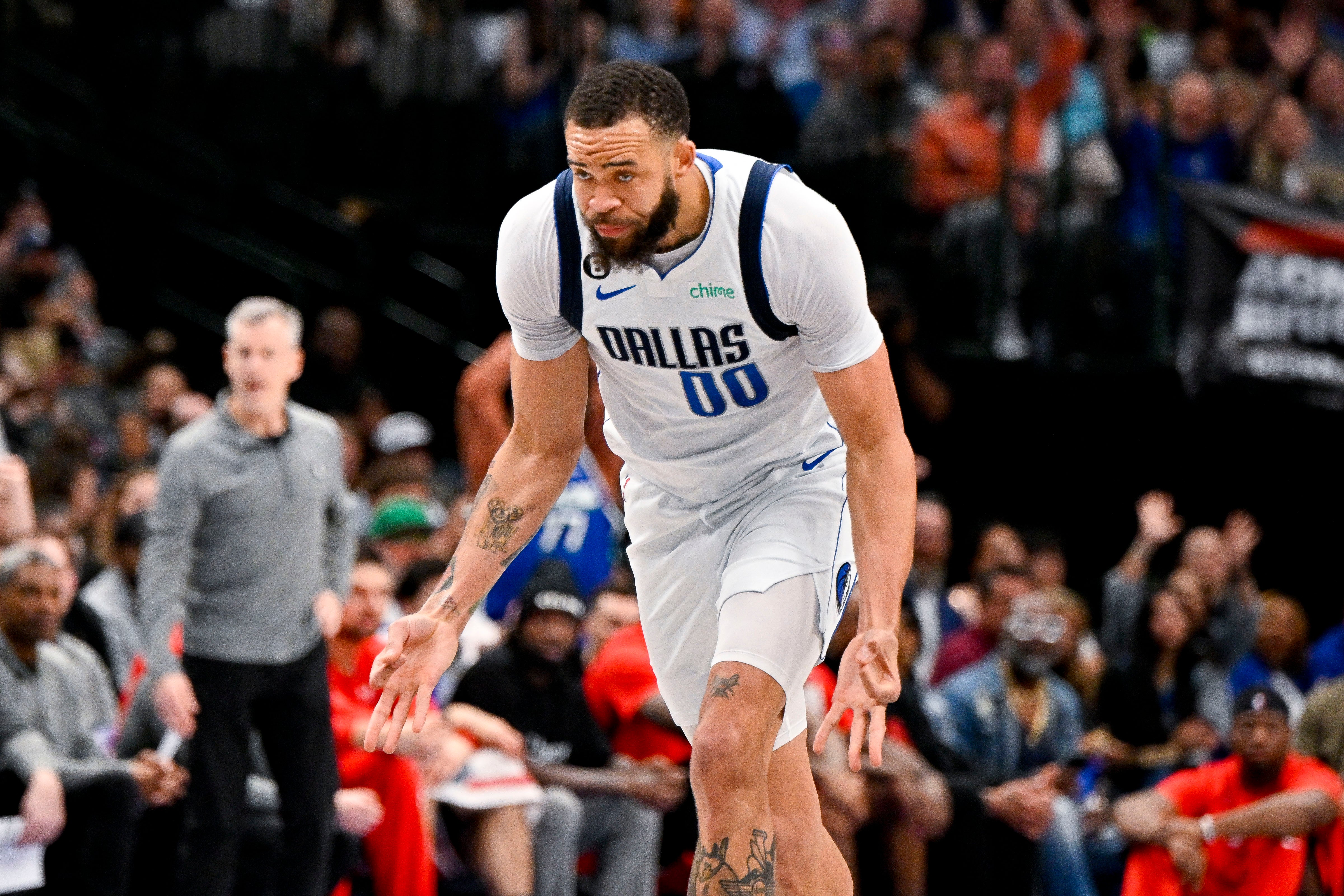 Apr 7, 2023; Dallas, Texas, USA; Dallas Mavericks center JaVale McGee (00) celebrates after making a three point shot against the Chicago Bulls during the first half at the American Airlines Center.