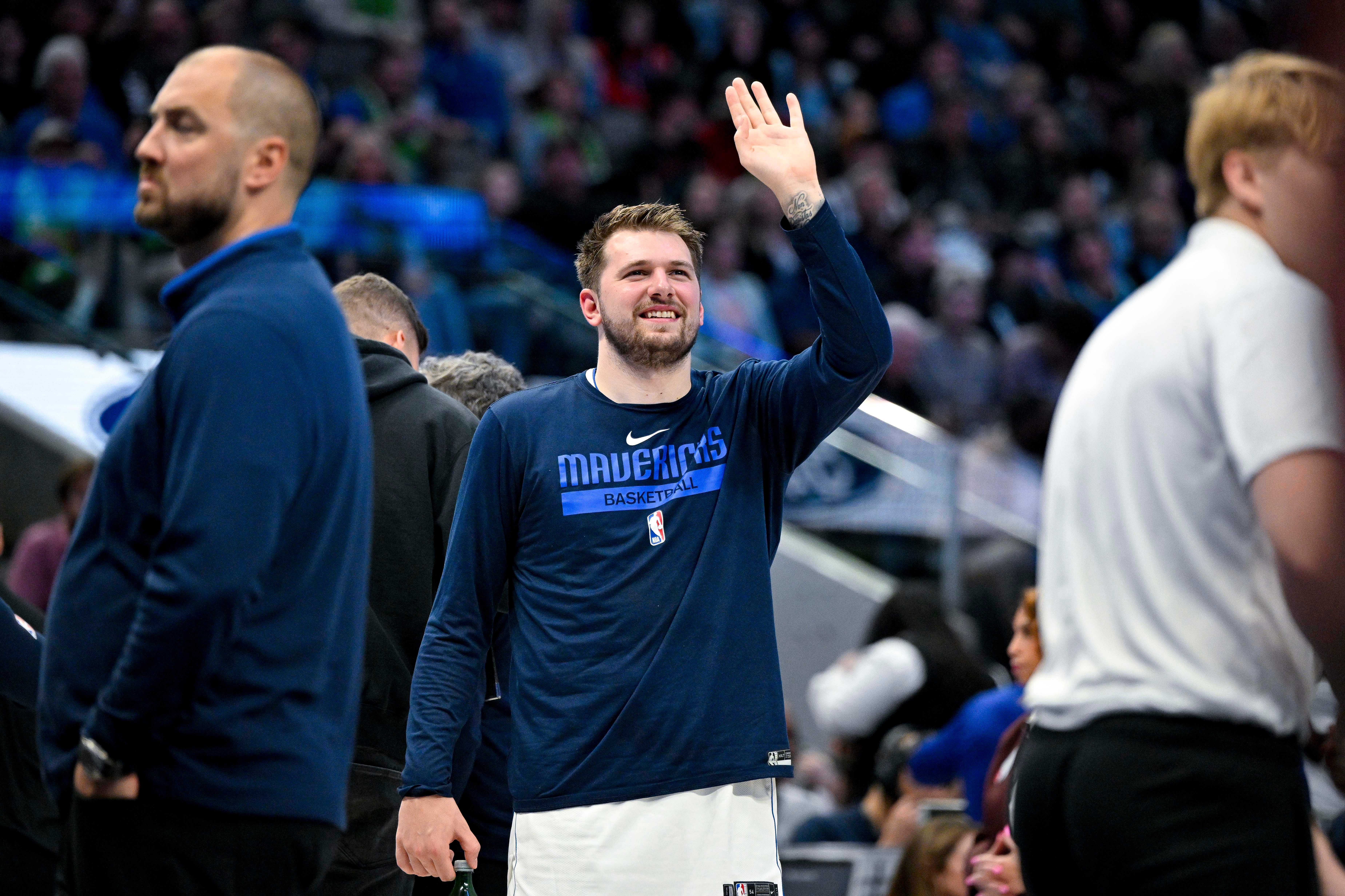 Apr 7, 2023; Dallas, Texas, USA; Dallas Mavericks guard Luka Doncic (77) waves to the crowd during the second quarter against the Chicago Bulls at the American Airlines Center.