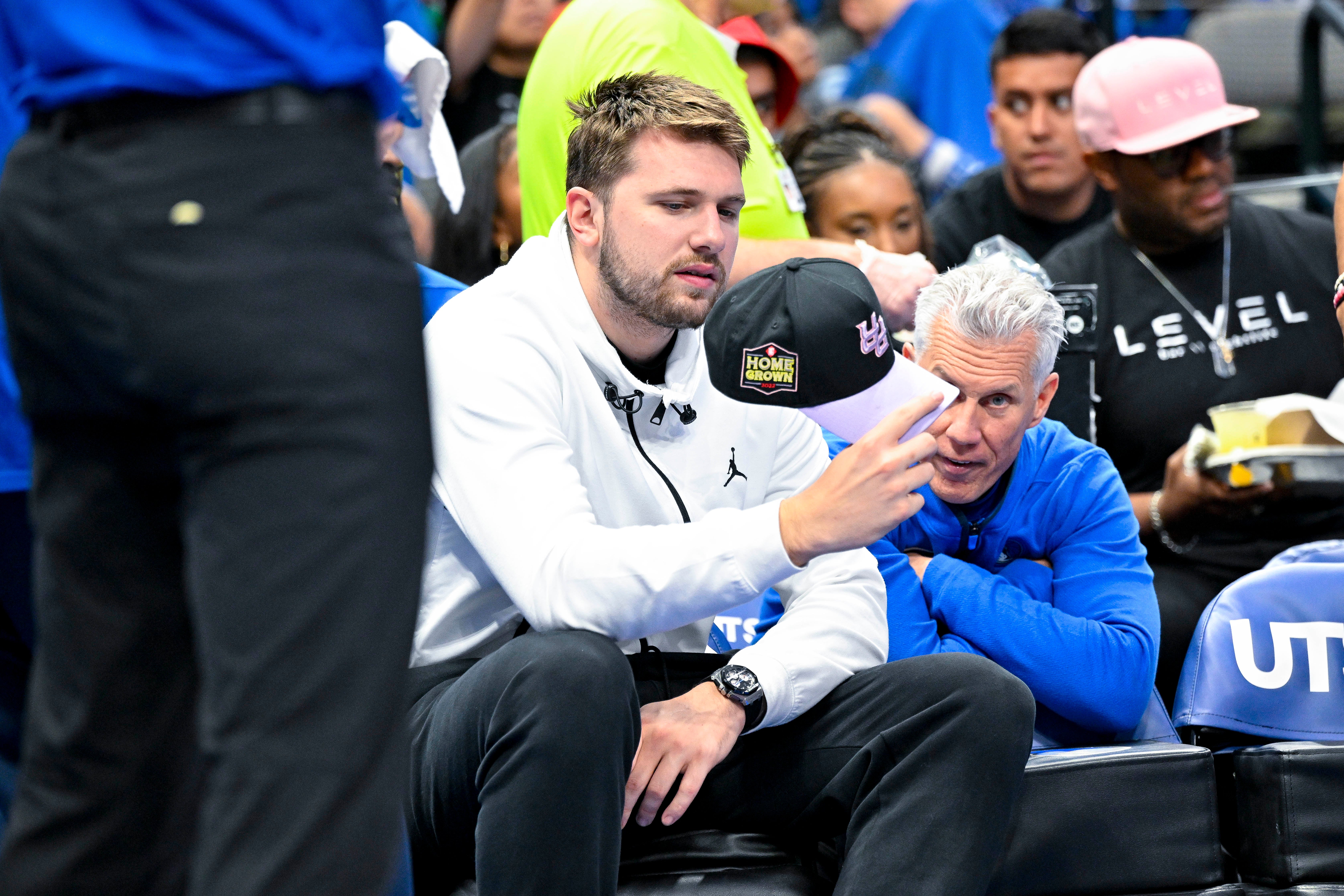 Apr 9, 2023; Dallas, Texas, USA; Dallas Mavericks guard Luka Doncic (77) sits on the team bench during a timeout in the second quarter of the game between the Dallas Mavericks and the San Antonio Spurs at the American Airlines Center.