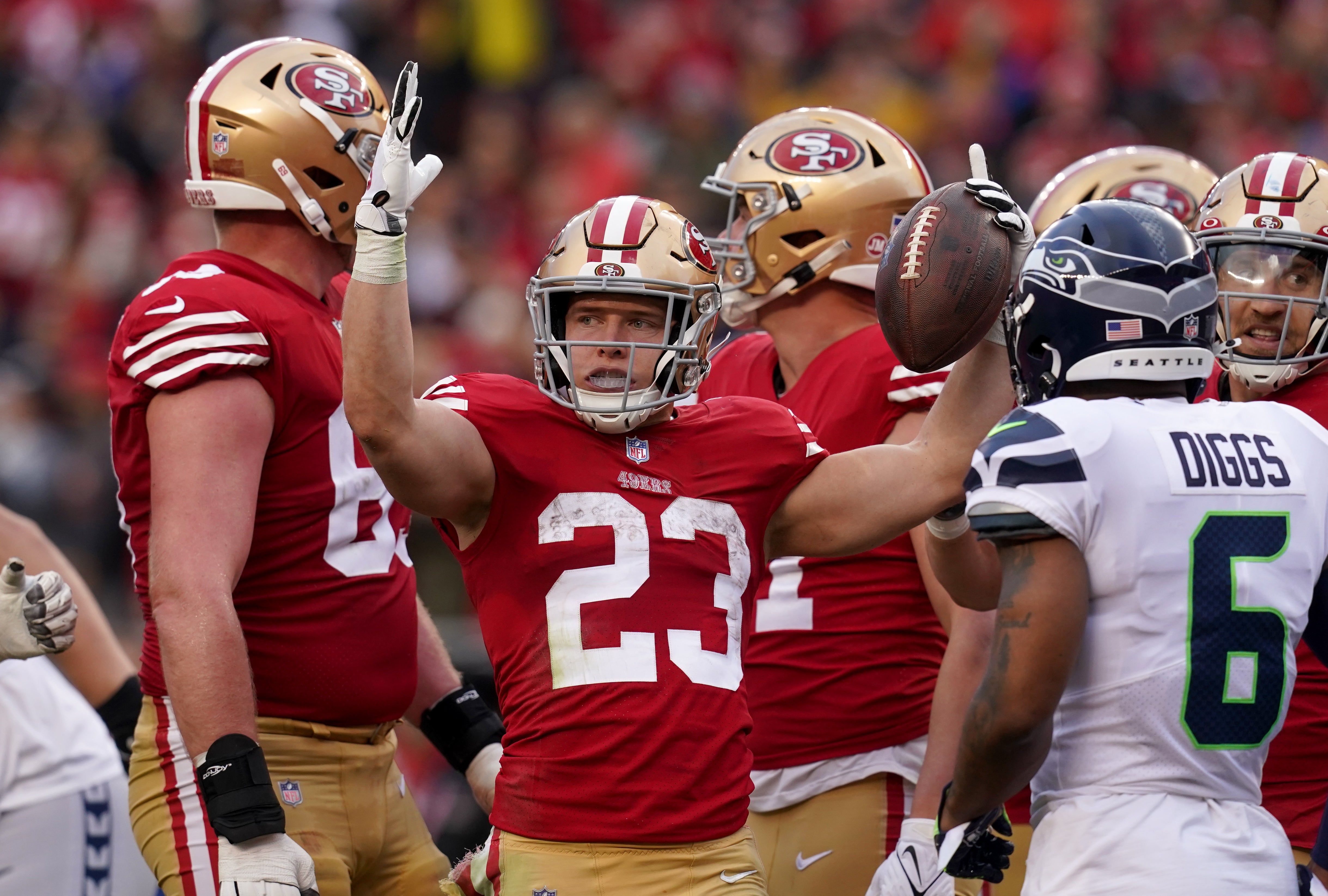 Jan 14, 2023; Santa Clara, California, USA; San Francisco 49ers running back Christian McCaffrey (23) looks for a touchdown signal in the third quarter of a wild card game against the Seattle Seahawks at Levi's Stadium. Officials called him short of the goal line.
