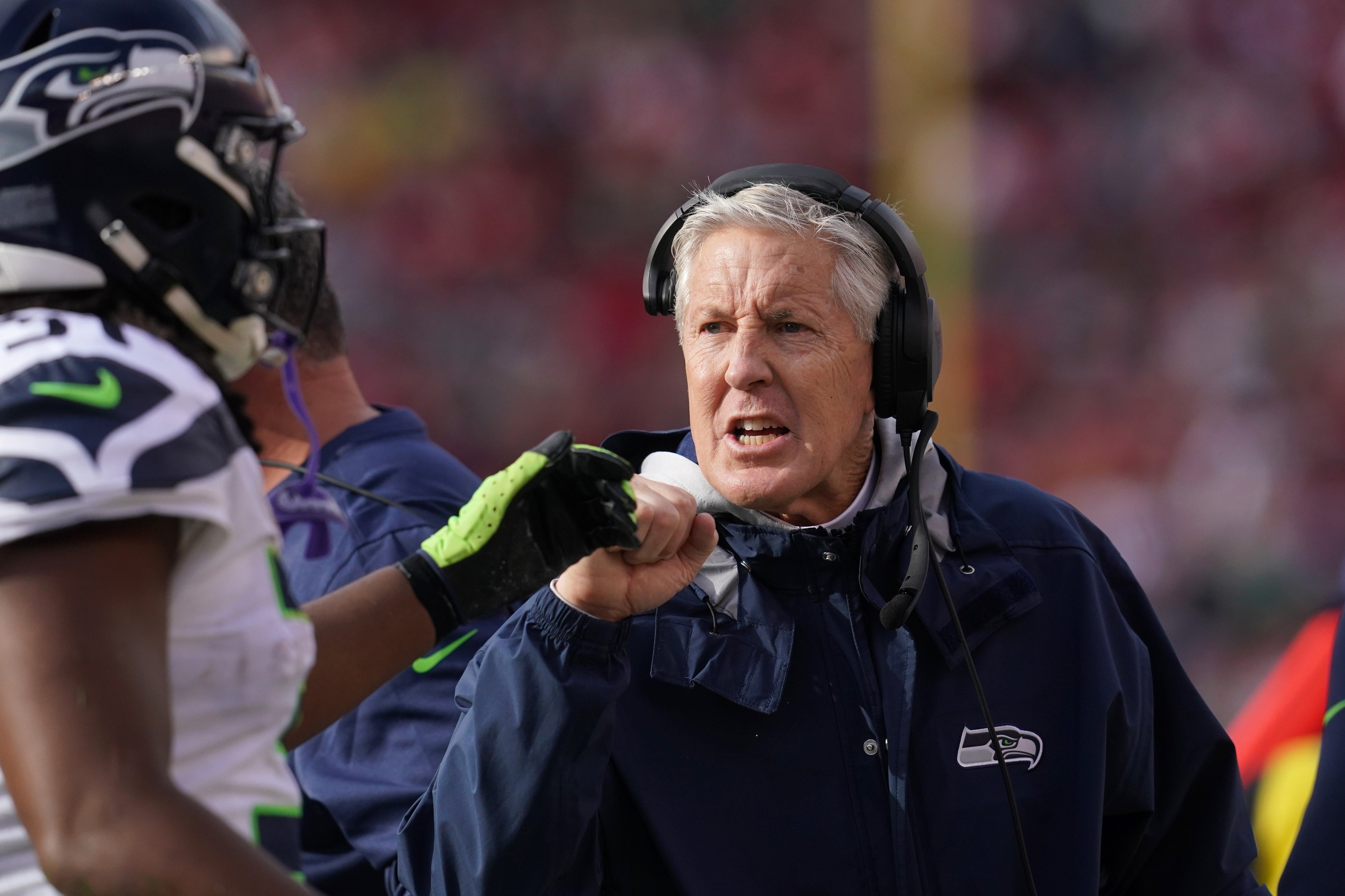 Jan 14, 2023; Santa Clara, California, USA; Seattle Seahawks head coach Pete Carroll talks to running back DeeJay Dallas on the sidelines in the second quarter of a wild card game against the San Francisco 49ers at Levi's Stadium.