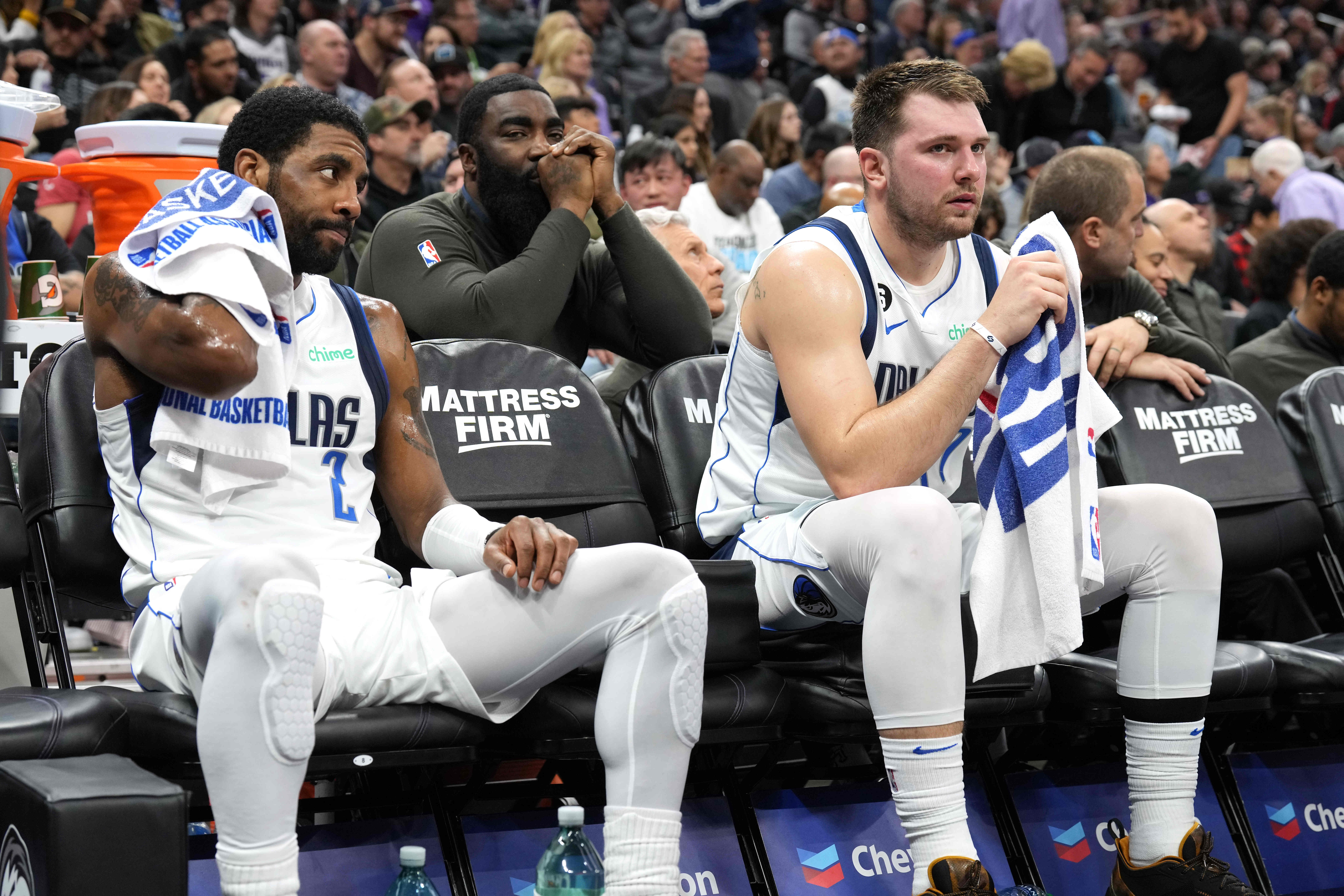 Feb 11, 2023; Sacramento, California, USA; Dallas Mavericks guard Kyrie Irving (2) and guard Luka Doncic (right) sit on the bench during the third quarter against the Sacramento Kings at Golden 1 Center.
