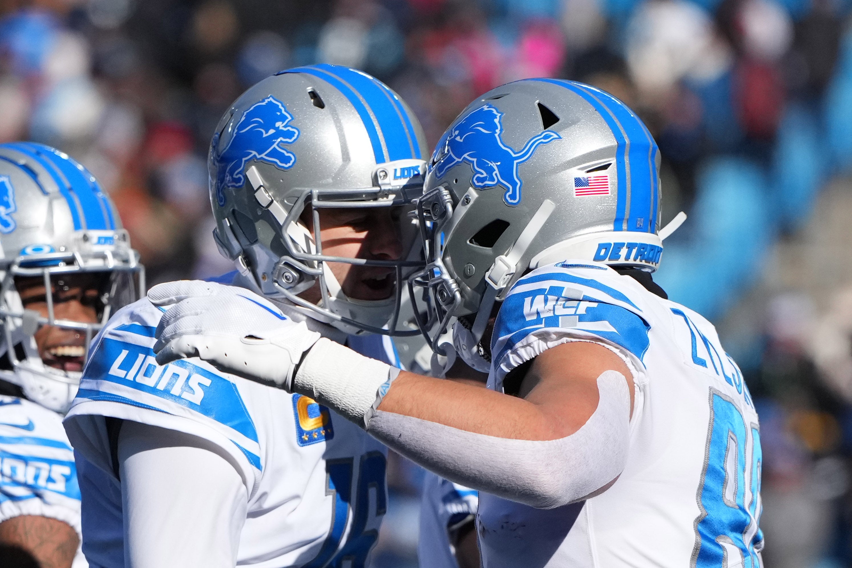 Dec 24, 2022; Charlotte, North Carolina, USA; Detroit Lions tight end Shane Zylstra (84) celebrates with quarterback Jared Goff (16) after scoring a touchdown in the first quarter at Bank of America Stadium. Mandatory Credit: Bob Donnan-USA TODAY Sports