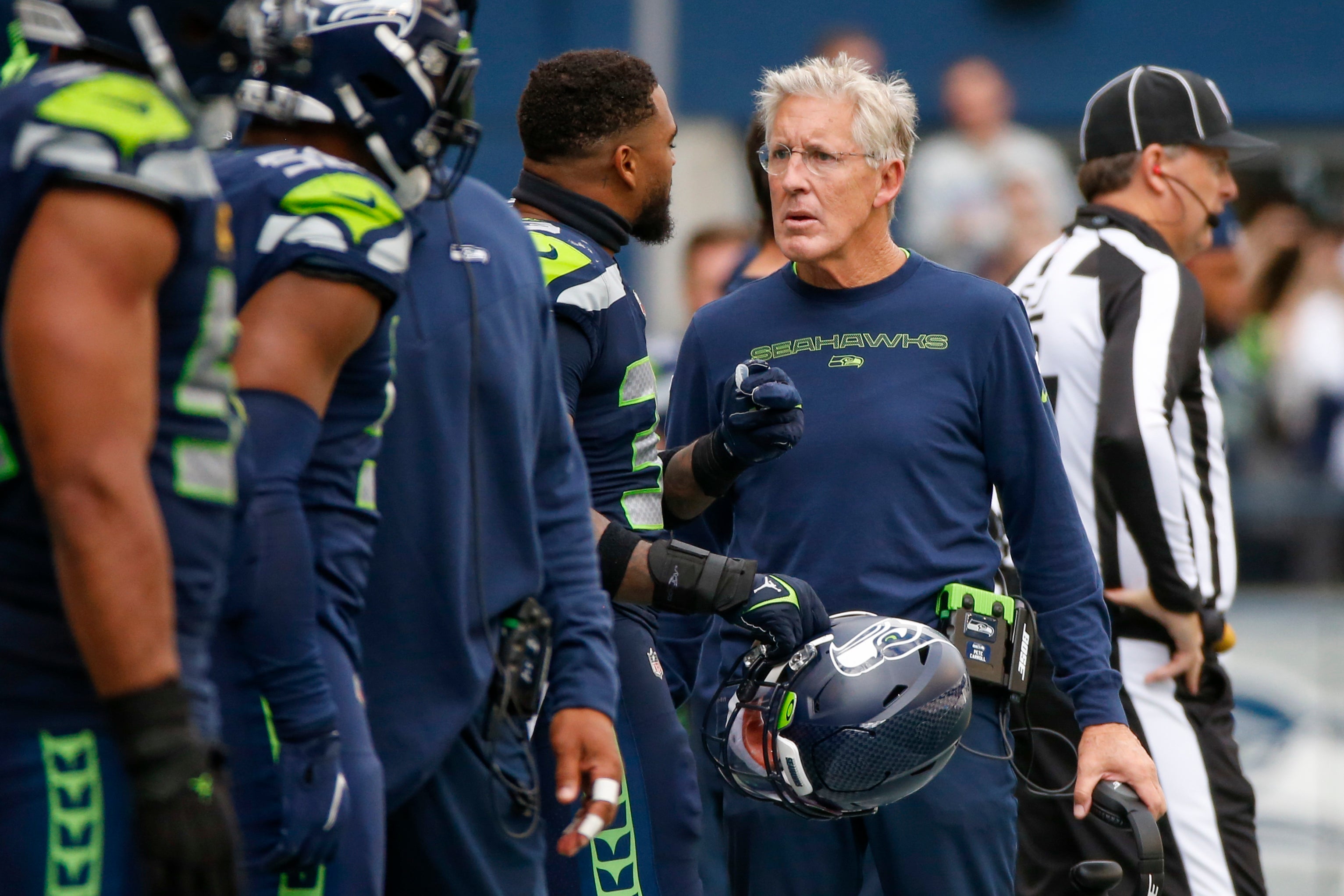 Sep 19, 2021; Seattle, Washington, USA; Seattle Seahawks head coach Pete Carroll talks with strong safety Jamal Adams (33) during the fourth quarter against the Tennessee Titans at Lumen Field.