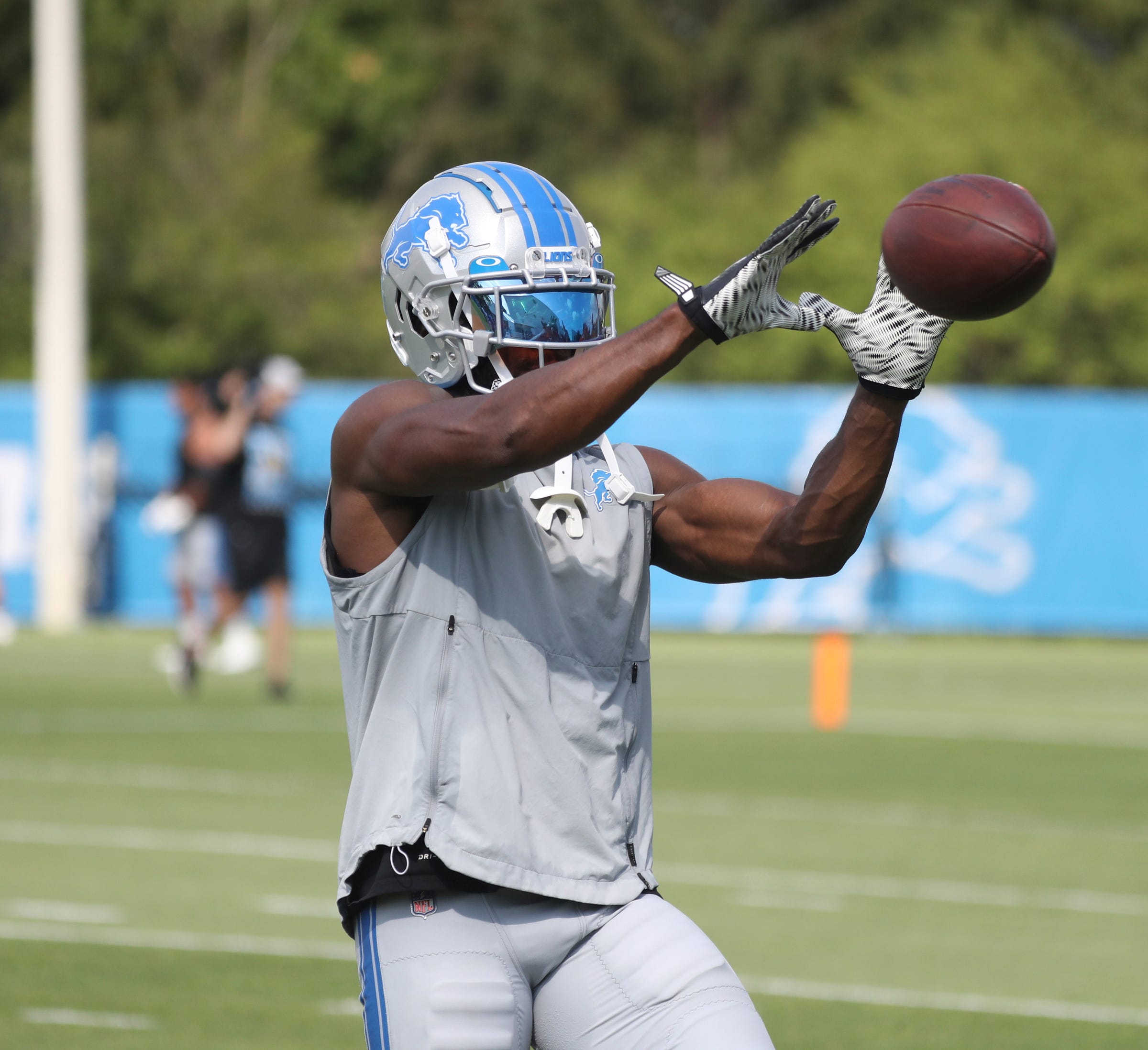 Lions receiver Quintez Cephus catches balls after the team's first padded practice of preseason camp Aug. 1, 2022 in Allen Park. Lions