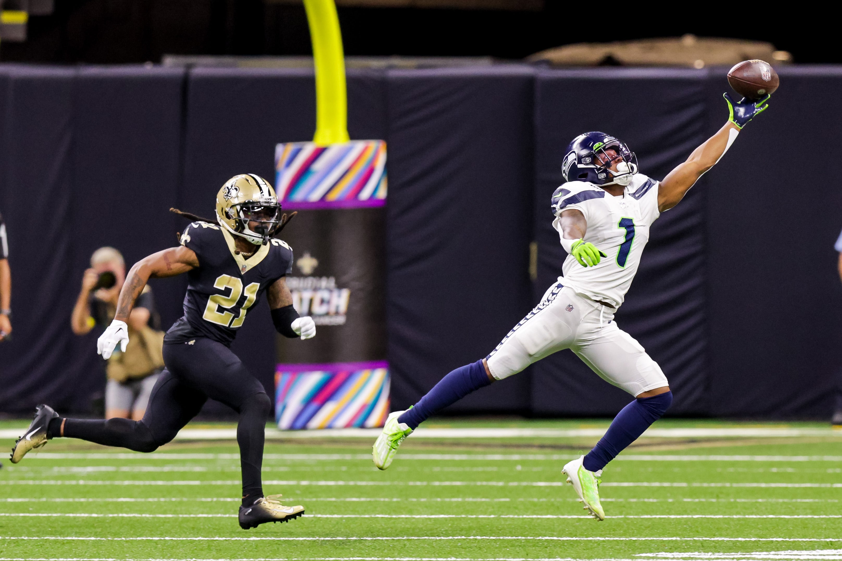 Oct 9, 2022; New Orleans, Louisiana, USA; Seattle Seahawks wide receiver Dee Eskridge (1) misses a pass as New Orleans Saints cornerback Bradley Roby (21) follows during the second half at Caesars Superdome.