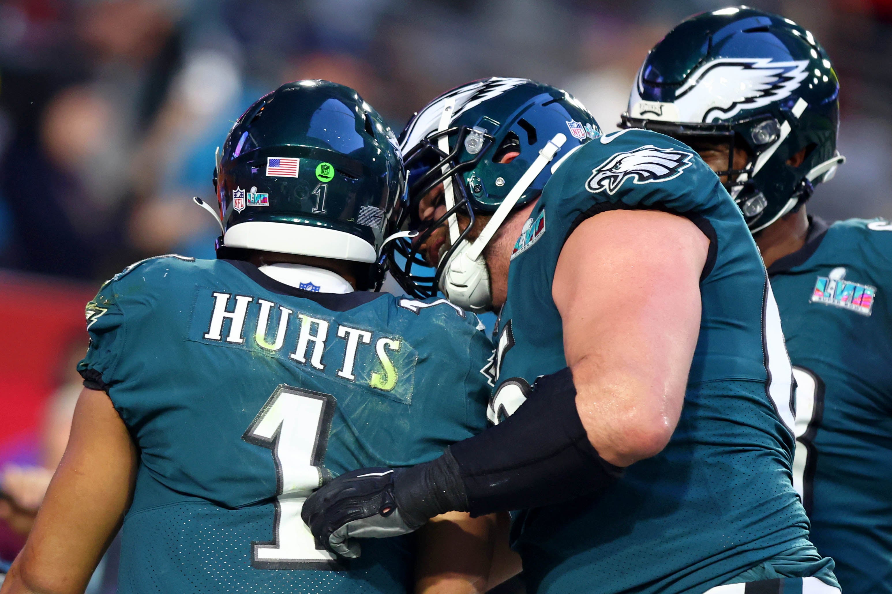 Feb 12, 2023; Glendale, Arizona, US; Philadelphia Eagles quarterback Jalen Hurts (1) is congratulated after scoring a touchdown against the Kansas City Chiefs during the second quarter of Super Bowl LVII at State Farm Stadium.