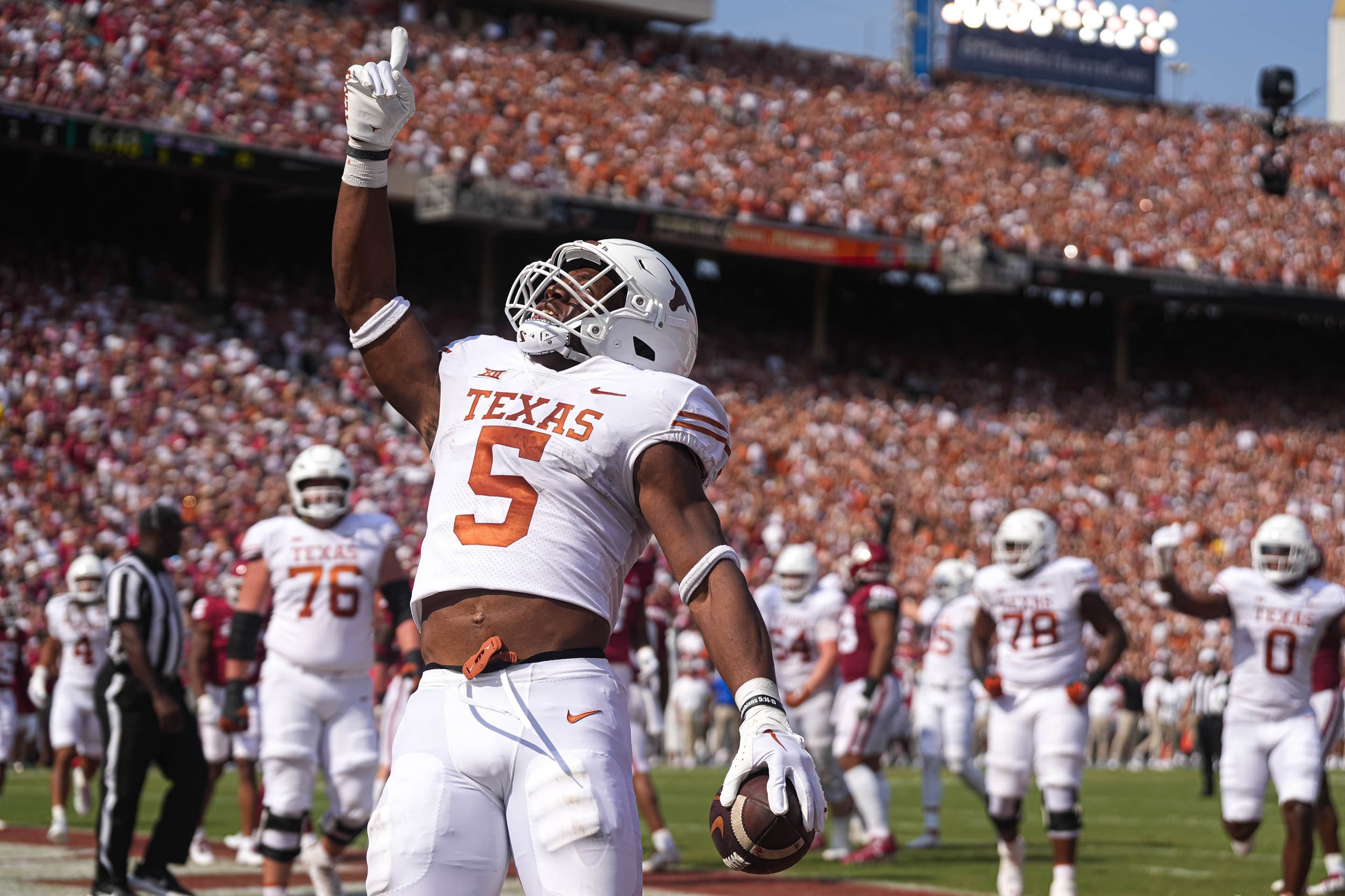 Texas running back Bijan Robinson (5) celebrates a touchdown during the annual Red River Showdown against Oklahoma at the Cotton Bowl in Dallas, Texas on Oct. 8, 2022. Aem Tx Vs Ou 21.