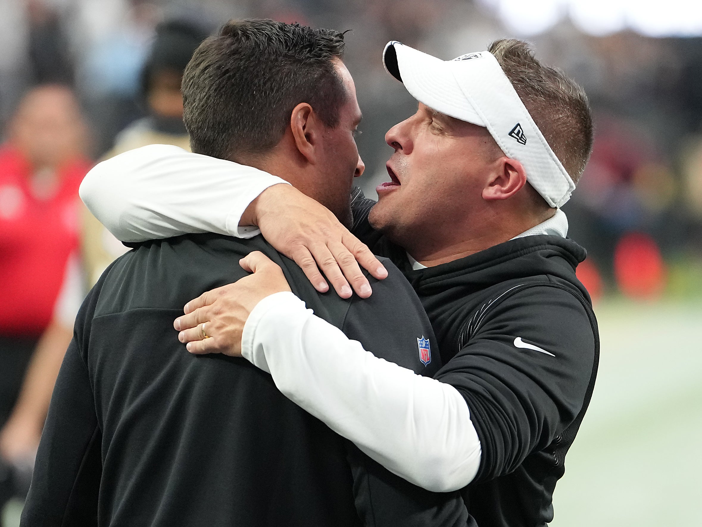 Oct 2, 2022; Paradise, Nevada, USA; Las Vegas Raiders head coach Josh McDaniels embraces Las Vegas Raiders General Manager Dave Ziegler after the Raiders defeated the Denver Broncos 32-23 at Allegiant Stadium.