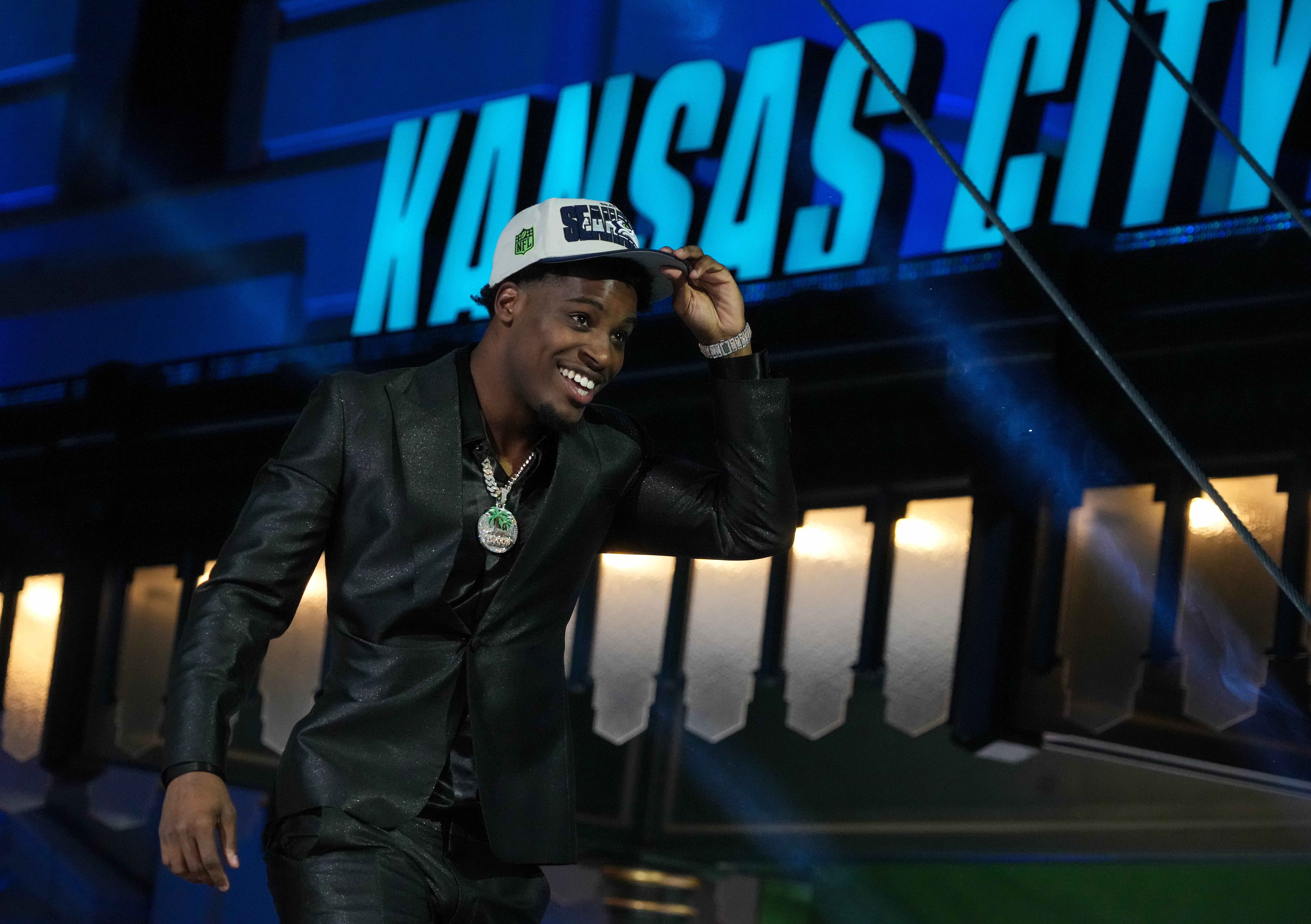 Apr 27, 2023; Kansas City, MO, USA; Illinois cornerback Devon Witherspoon reacts after being selected by the Seattle Seahawks fifth overall in the first round of the 2023 NFL Draft at Union Station.