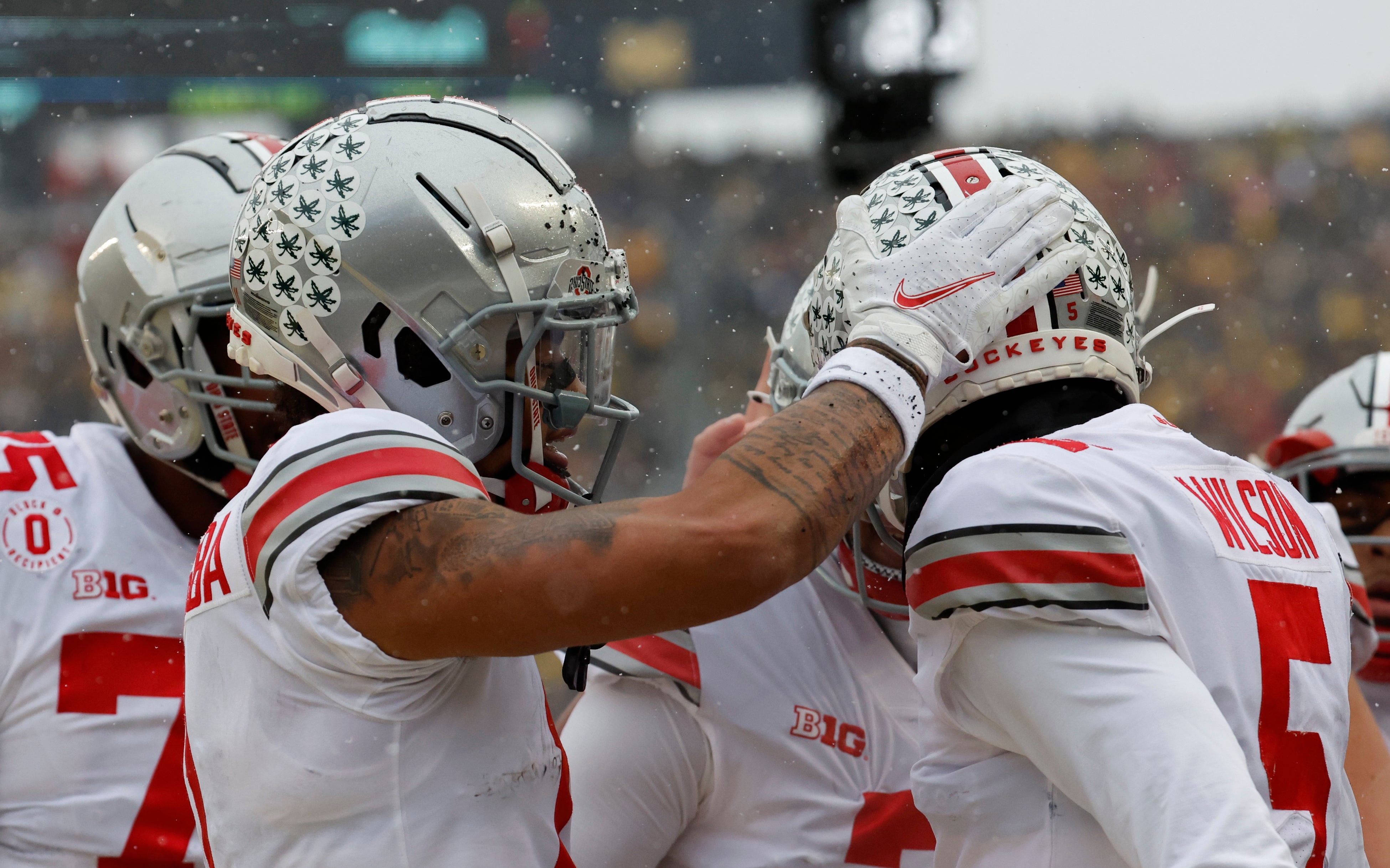 Nov 27, 2021; Ann Arbor, Michigan, USA; Ohio State Buckeyes wide receiver Jaxon Smith-Njigba (11) and wide receiver Garrett Wilson (5) celebrate a play in the first half against the Michigan Wolverines at Michigan Stadium.