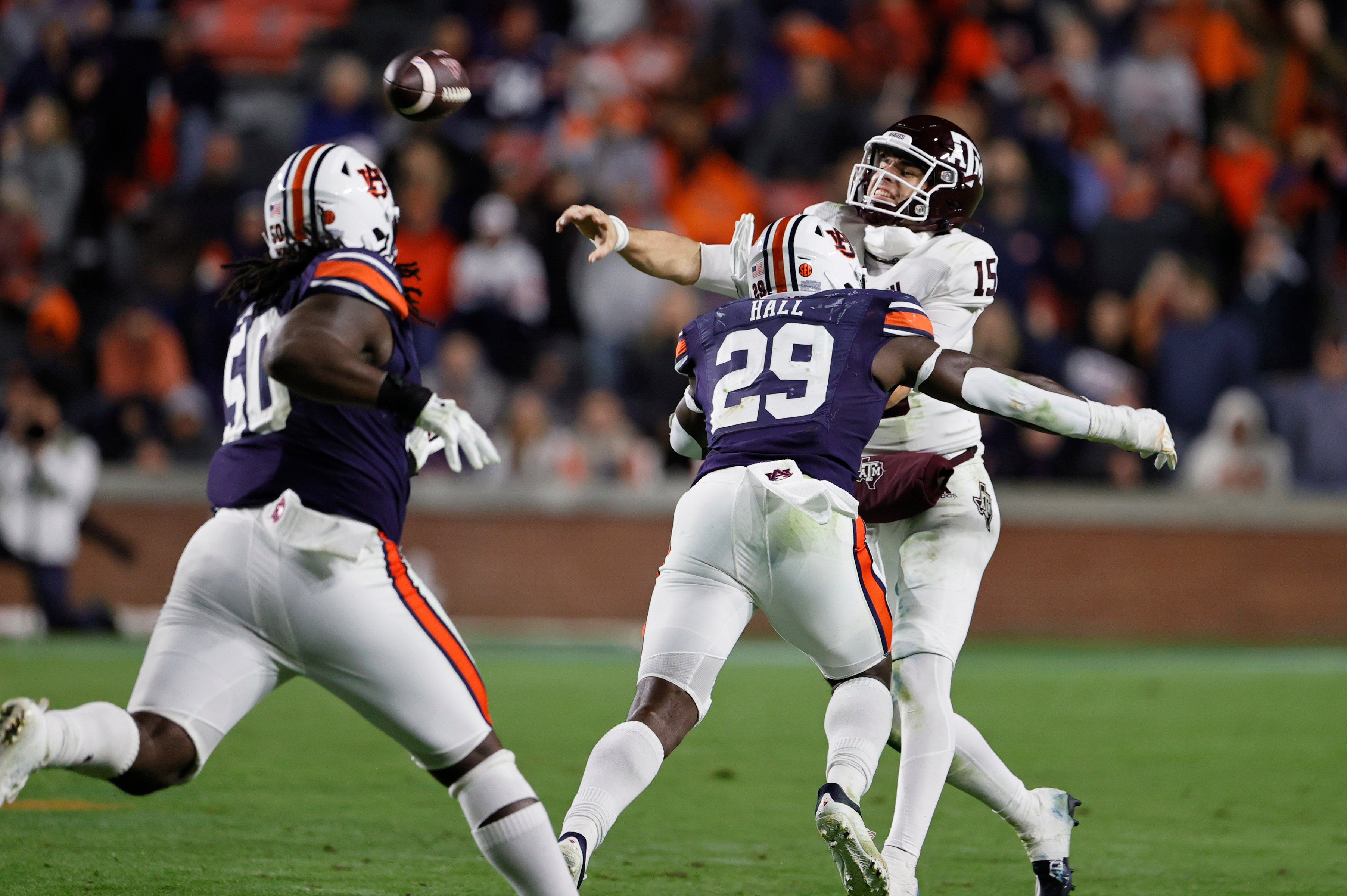 Nov 12, 2022; Auburn, Alabama, USA; Texas A&M Aggies quarterback Conner Weigman (15) gets rid of the ball as Auburn Tigers linebacker Derick Hall (29) closes in during the fourth quarter at Jordan-Hare Stadium.