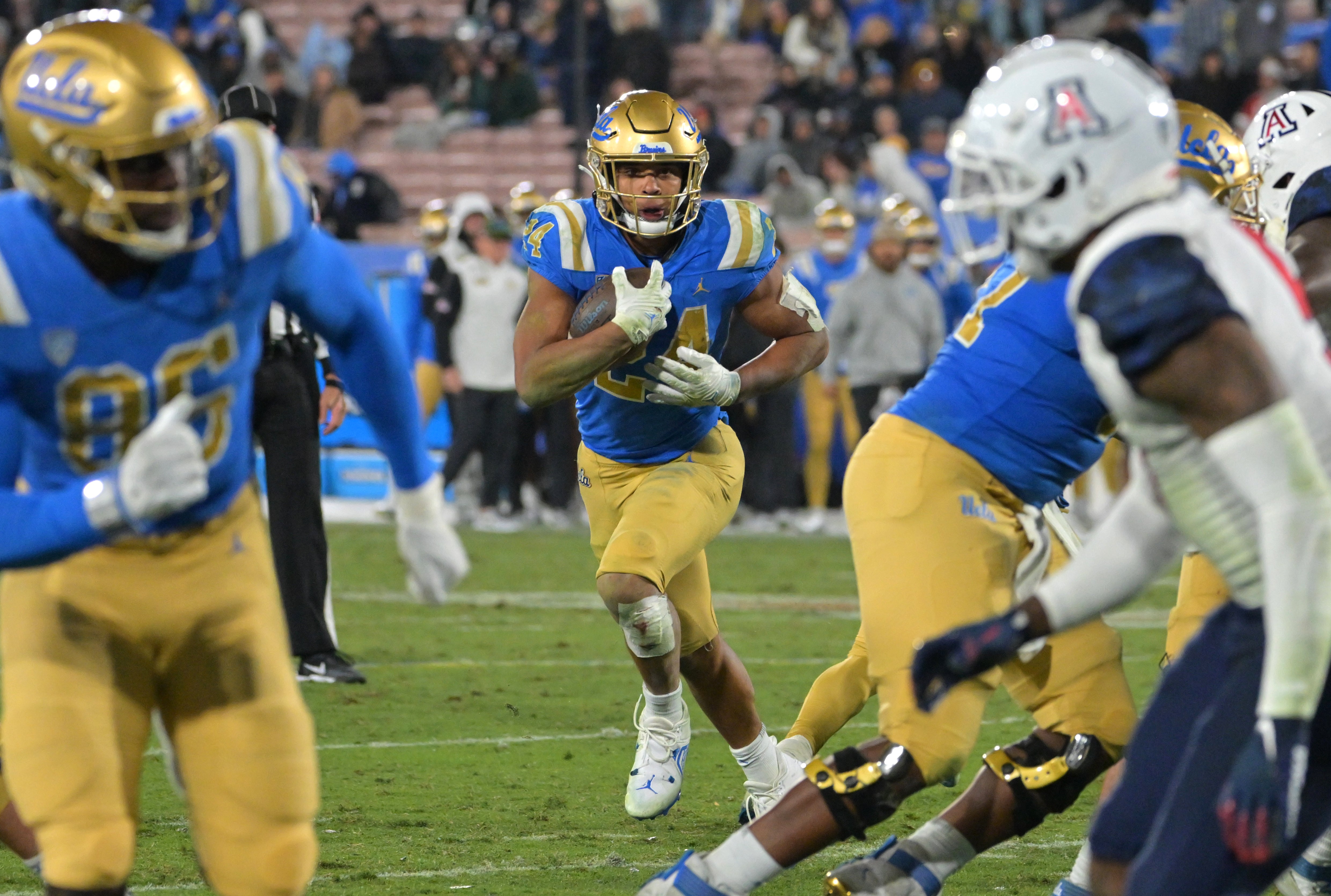 Nov 12, 2022; Pasadena, California, USA; UCLA Bruins running back Zach Charbonnet (24) carries the ball just into the end zone for a touchdown in the second half against the Arizona Wildcats at the Rose Bowl.