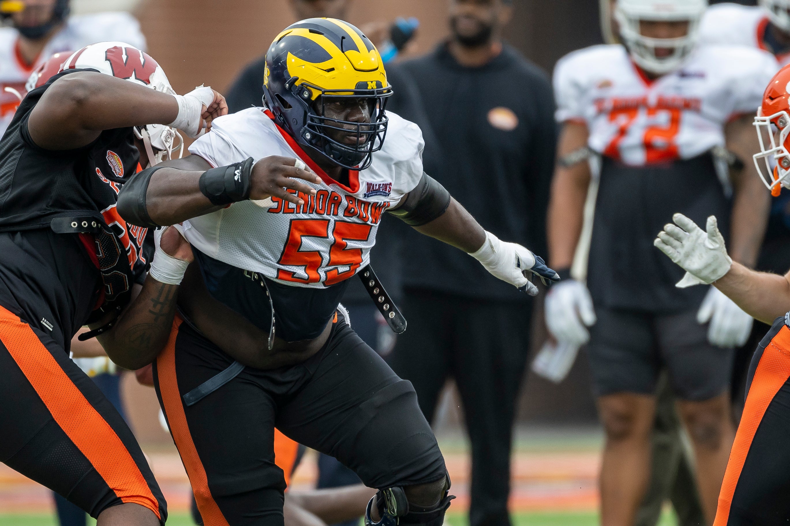 Feb 2, 2023; Mobile, AL, USA; National offensive lineman Olusegun Oluwatimi of Michigan (55) practices during the third day of Senior Bowl week at Hancock Whitney Stadium in Mobile.