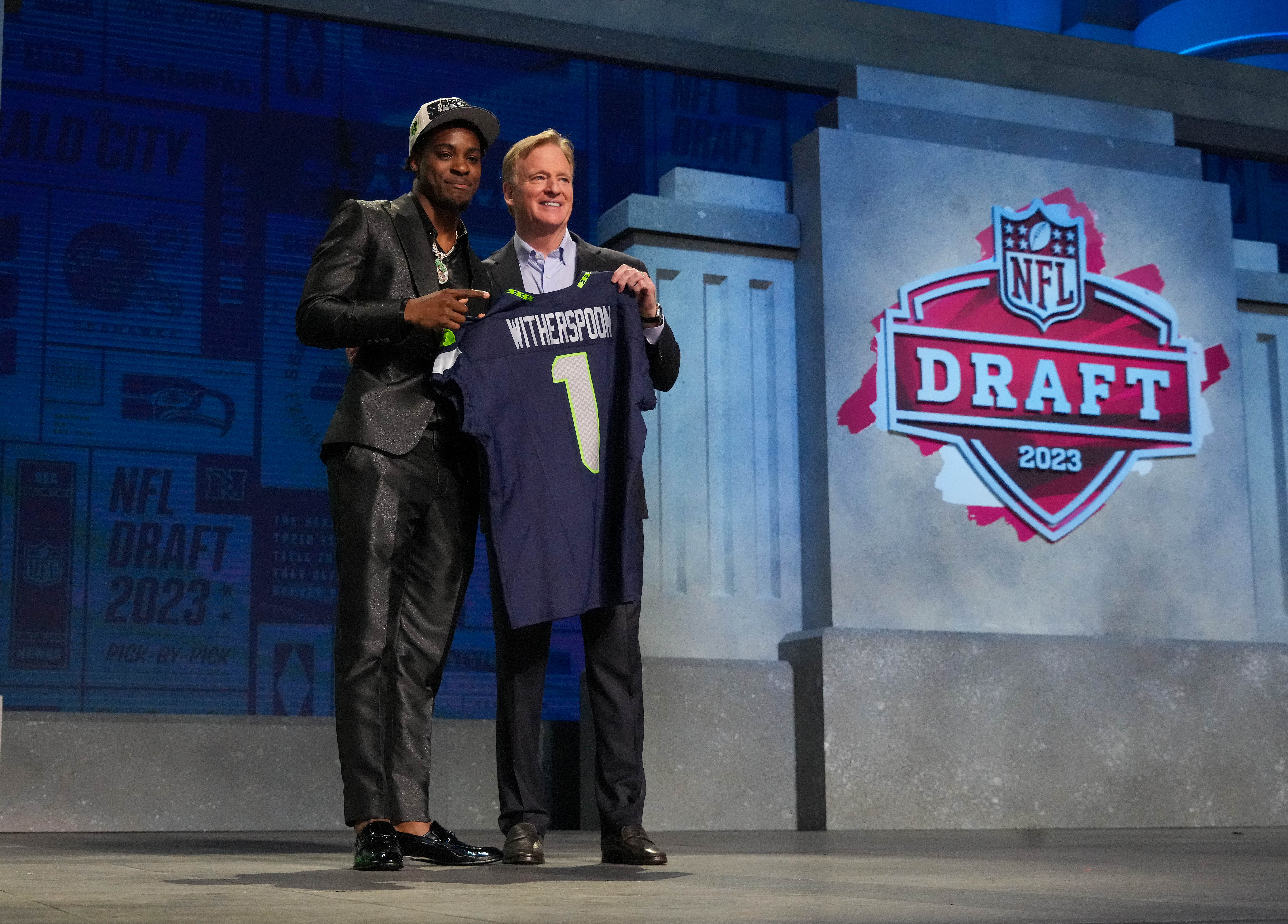 Apr 27, 2023; Kansas City, MO, USA; Illinois cornerback Devon Witherspoon with NFL commissioner Roger Goodell after being selected by the Seattle Seahawks fifth overall in the first round of the 2023 NFL Draft at Union Station.