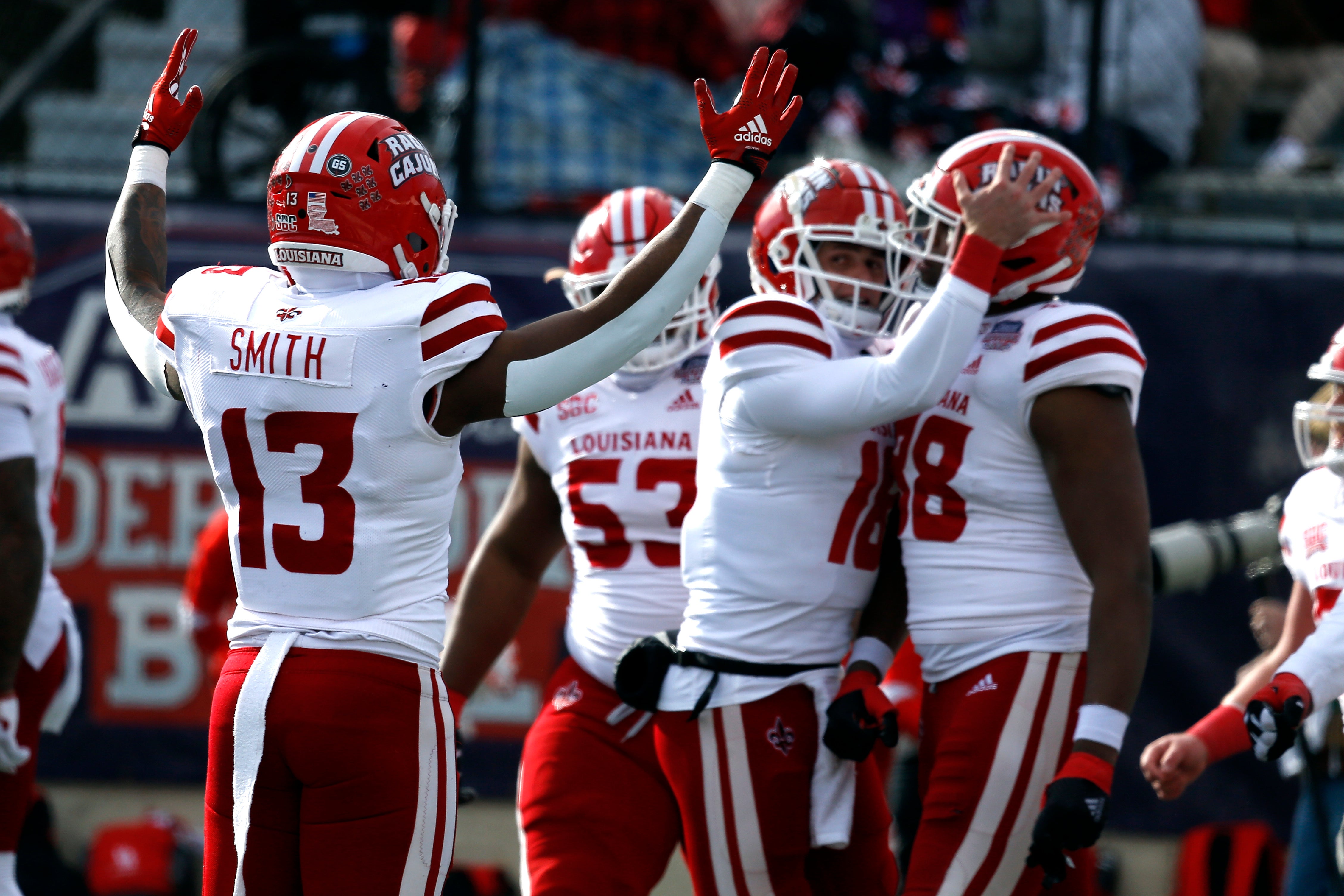 Dec 23, 2022; Shreveport, Louisiana, USA; Louisiana-Lafayette Ragin' Cajuns running back Chris Smith (13) reacts after a touchdown during the first half against the Houston Cougars in the 2022 Independence Bowl at Independence Stadium.