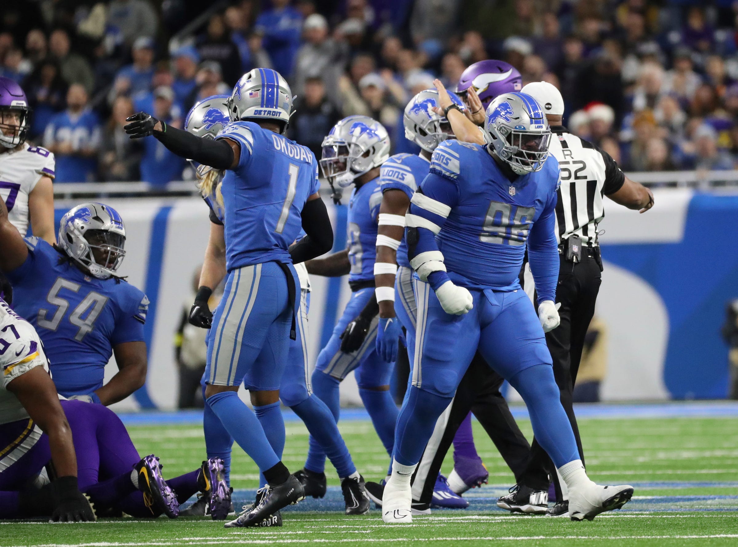 ions defensive end Isaiah Buggs celebrates after tackling Vikings running back Dalvin Cook on fourth down during the first half of the Lions' 34-23 win over the Vikings on Sunday, Dec. 11, 2022, at Ford Field. Lionsminn 121122 Kd 3835