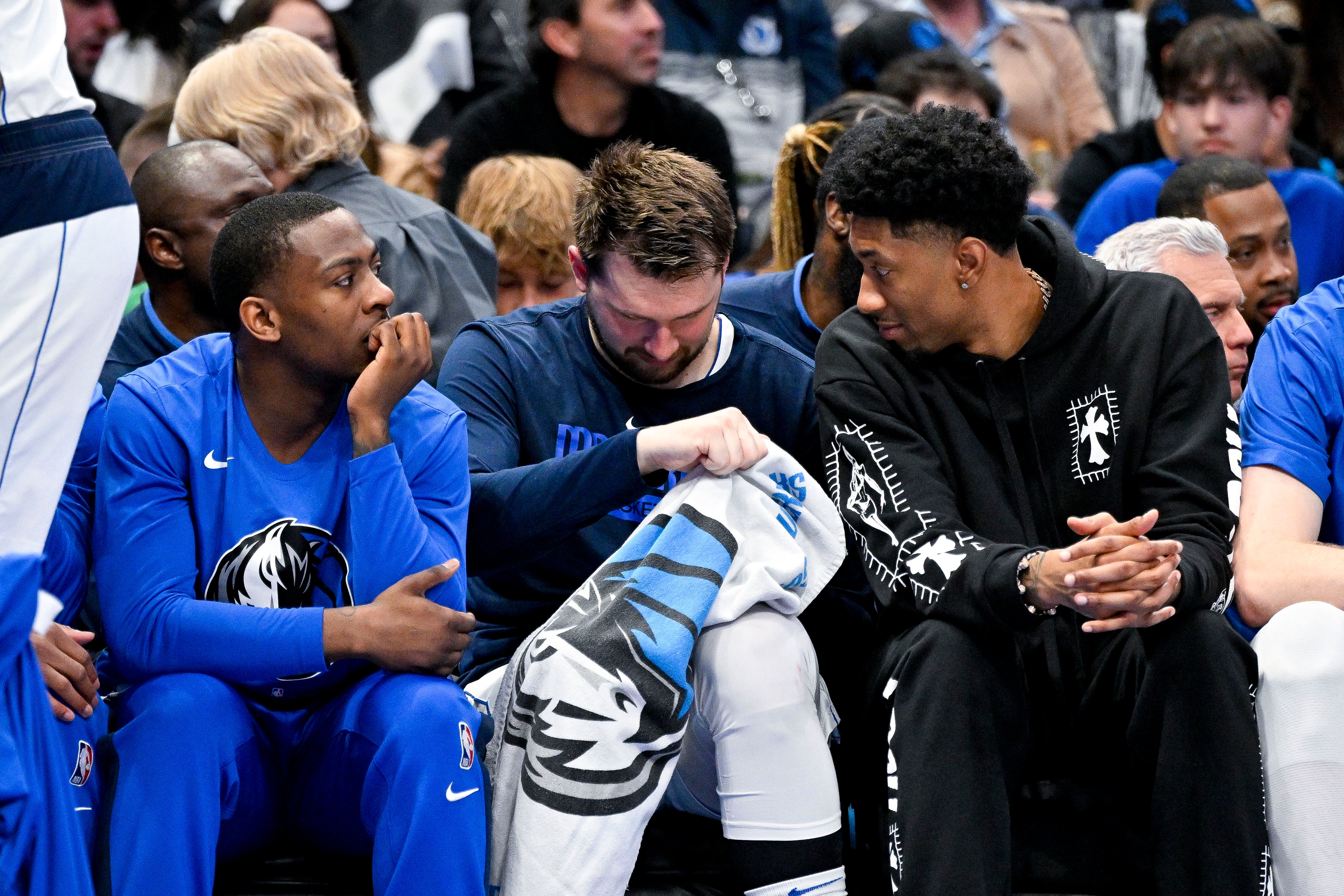 Apr 7, 2023; Dallas, Texas, USA; Dallas Mavericks guard McKinley Wright IV (23) and guard Luka Doncic (77) and forward Christian Wood (35) sit on the team bench during the first half against the Chicago Bulls at the American Airlines Center.