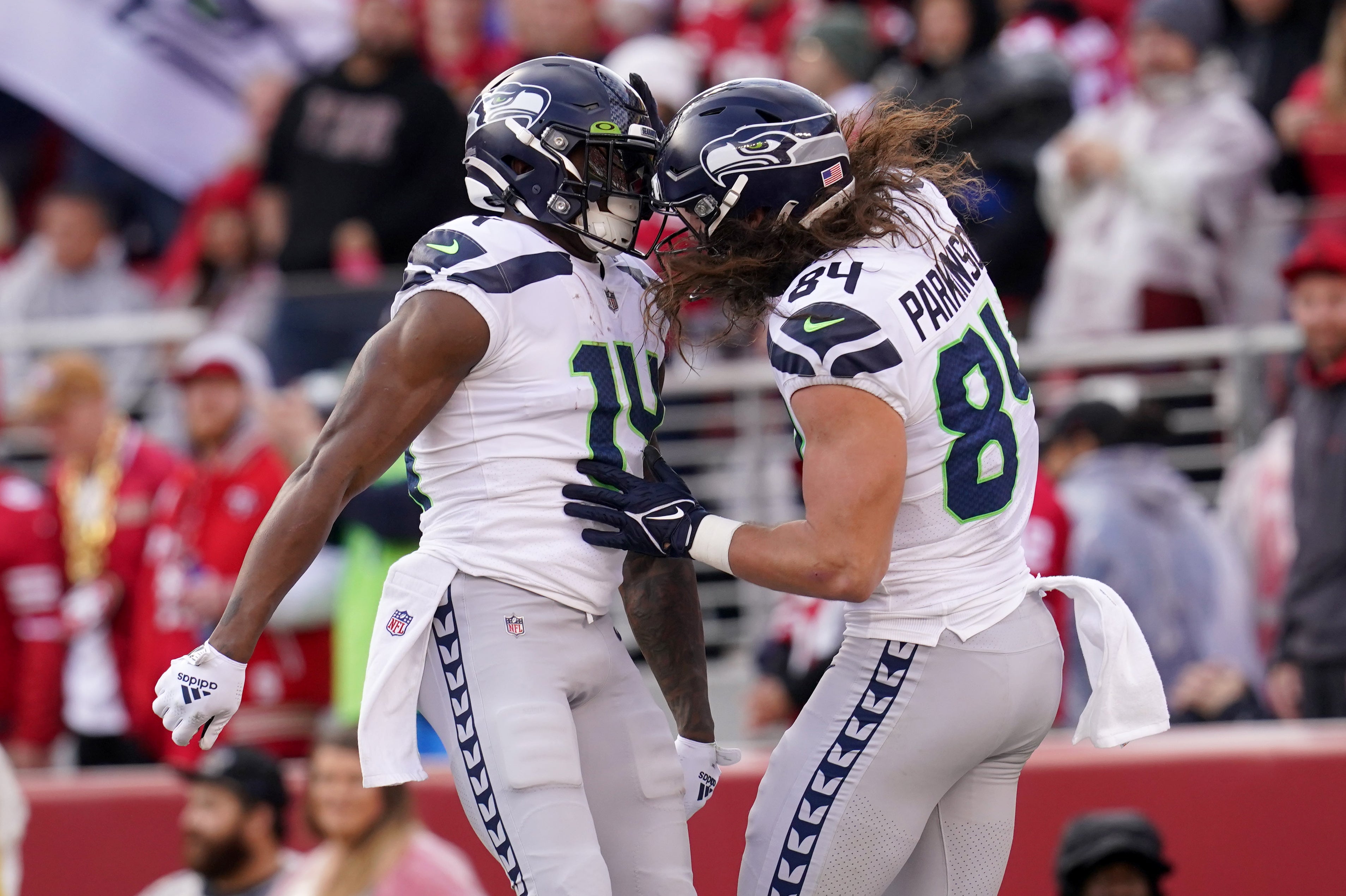 Jan 14, 2023; Santa Clara, California, USA; Seattle Seahawks wide receiver DK Metcalf (14) celebrates his 50-yard touchdown catch and run with tight end Colby Parkinson (84) in the second quarter of a wild card game against the San Francisco 49ers at Levi's Stadium