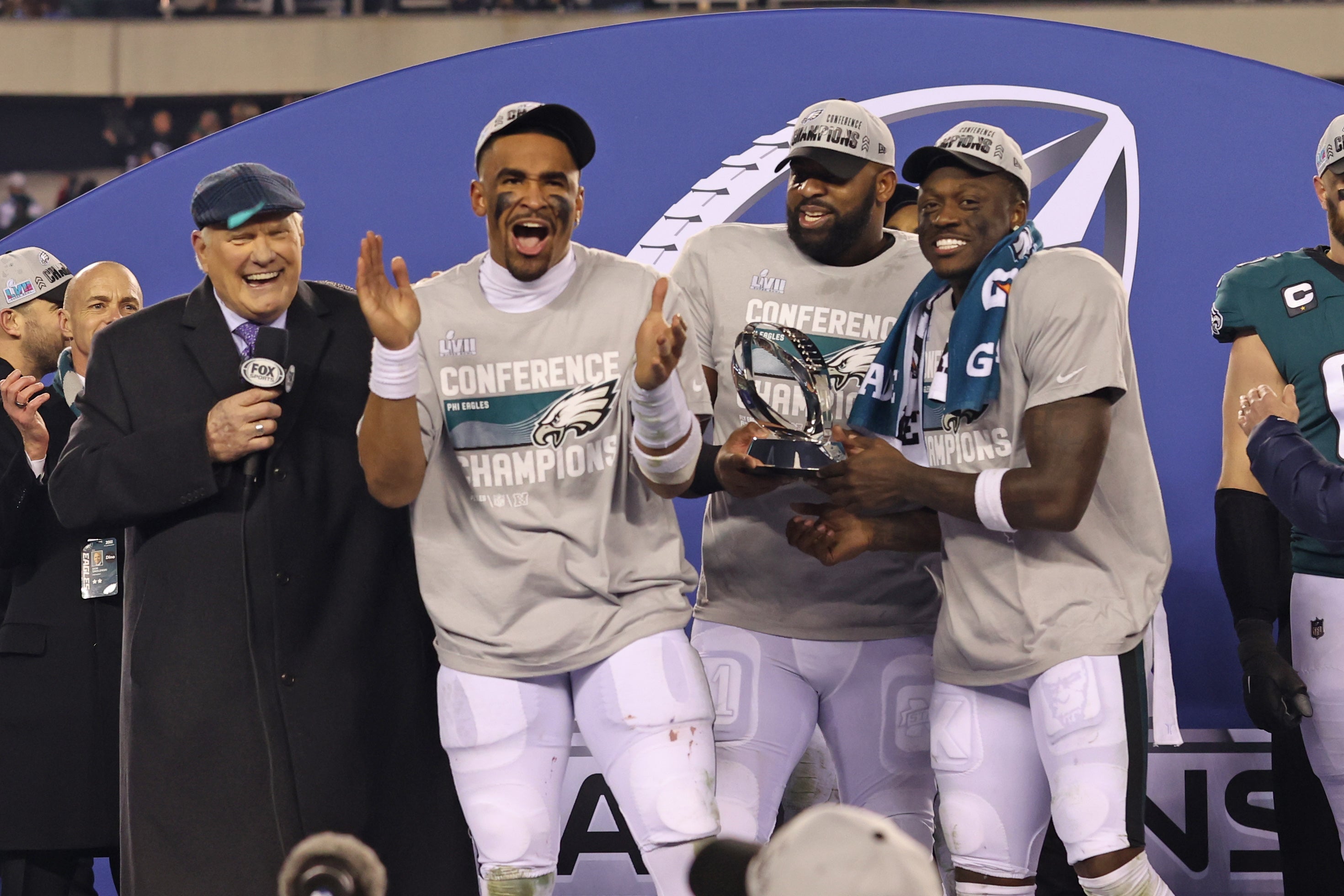 Jan 29, 2023; Philadelphia, Pennsylvania, USA; Philadelphia Eagles quarterback Jalen Hurts (1), defensive tackle Fletcher Cox (91) and wide receiver A.J. Brown (11) during the NFC Championship trophy presentation after win against the San Francisco 49ers in the NFC Championship game at Lincoln Financial Field. Mandatory Credit: Bill Streicher-USA TODAY Sports